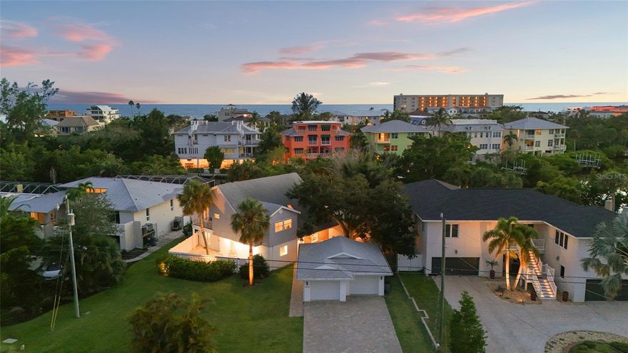 Welcome to 430 Island Circle, where island living feels both luxurious and refreshingly relaxed. Set on Palm Island, the “heart of Siesta Key”, just moments from the sugar-white sands of Siesta Key Beach, this home offers the perfect balance of modern comfort and coastal charm.

Completely reimagined from top to bottom, this five bedroom, three and a half bathroom residence opens with sun-filled living spaces, soaring ceilings, and impact windows throughout. At the center of it all is a chef’s kitchen with an oversized quartz island, ideal for both entertaining and everyday life. Just beyond, the living areas connect effortlessly to the backyard, where you’ll find what few homes on Siesta Key can offer: a wide expanse of green grass paired with a sparkling heated pool and tranquil waterfront views.

The primary suite is a retreat of its own, featuring a high-end bathroom designed to rival a spa. A convenient pool bathroom keeps the coastal lifestyle easy and carefree. Upstairs, additional bedrooms provide plenty of room for family and guests, while a flexible layout ensures space for work or play. 

What truly sets this home apart is the location. From your front door, you are just a short stroll to the world-renowned Siesta Key Beach, consistently ranked among the best in the world for its powdery white quartz sand and turquoise waters. Equally close is Siesta Key Village, where mornings can begin with coffee at Mojo Risin’, afternoons with shopping or live music, and evenings with cocktails at Daiquiri Deck or a night out at the iconic Beach Club.

With a private dock, a detached two-car garage, and this unbeatable setting, 430 Island Circle is more than a home. It is a lifestyle, where every detail has been considered so you can simply move into your turnkey furnished Siesta Key dream home.