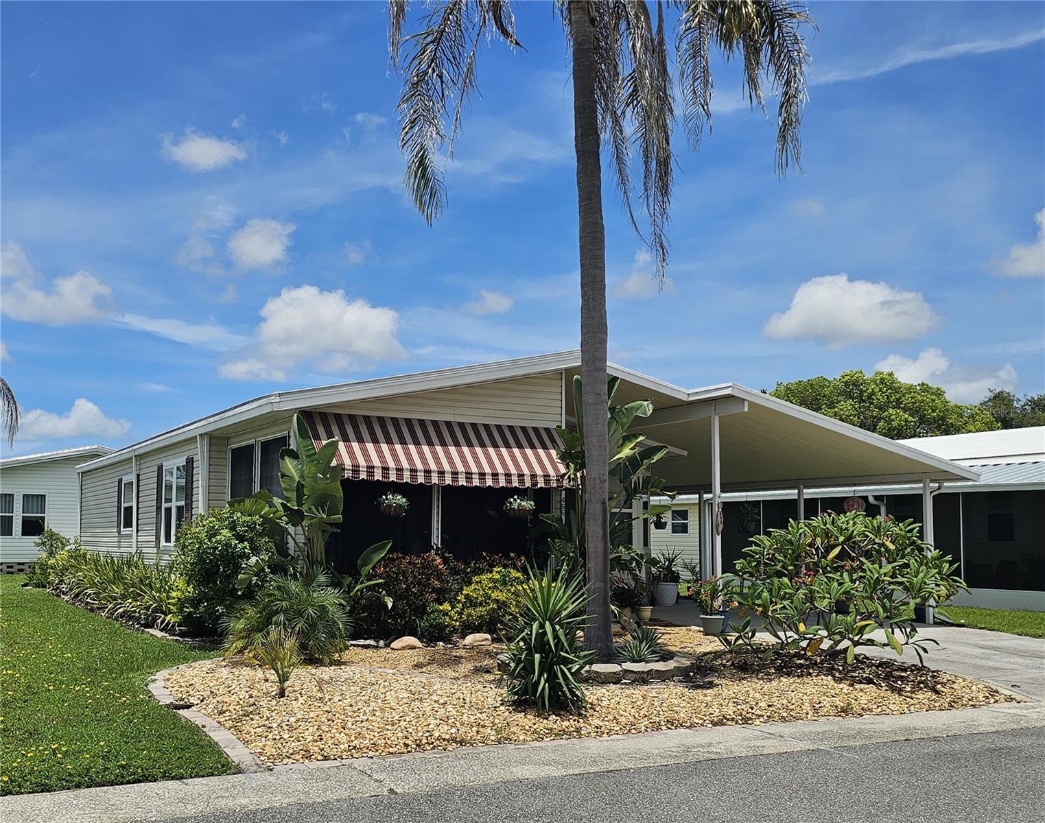 This Florida home with a coastal vibe awaits you in centrally located Oldsmar, Florida! Tucked in a quiet corner of Gull-Aire Village you can sit on your tranquil lanai and gaze at the magnificent palm tree and lush landscaping. This beautiful 2-bedroom/2-bathroom, move-in ready home features newer laminate and linoleum flooring, a stylish updated kitchen is complete with newer high quality wood cabinets with soft-close doors/drawers and a spacious kitchen island with an abundance of storage. The primary bedroom features an ensuite bathroom with newer vanity and a beautifully updated walk-in shower. But the best feature of all is, YOU OWN YOUR LOT!!!
Additional features include double pane windows throughout, indoor laundry, a 7 x 8 storage shed, an operational goldfish pond and rain barrel.
Gull-Aire Village is a 55+ golf cart friendly community that offers an enormous clubhouse, a large, heated pool/spa, sauna, library, enclosed shuffleboard court, bocce ball court along with a wide variety of planned activities and social events. The monthly HOA fee is only $60.00 and one pet of any size is permitted!
Gull-Aire Village is conveniently located less than 1 mile from Woodlands Square where you will find Bealls, Marshall’s, Ulta, PetSmart, Dollar Tree, AMC Theater, Craft Street Kitchen, Shaker & Peel, Eve’s Family Restaurant along with other service-oriented businesses. Mease Countryside Hospital and Medical Arts Building, Publix, Target, Walmart Neighborhood Market and more are conveniently located approx. 2 miles away. The Walmart Superstore is approx. 3 miles, Honeymoon Island Beach is approx. 9 miles, Tampa International Airport is approx. 15 miles and St. Pete-Clearwater International Airport is approx. 9 miles. A walking/running/biking trail is located adjacent to Canal Way, which takes you directly to picturesque Sheffield Park.
Whether you are participating in one or more of the many activities offered at the clubhouse or just relaxing by the beautiful sparkling pool or spa, you are sure to enjoy the peaceful, friendly atmosphere at Gull-Aire Village! Room dimensions are approximate and to be verified by Buyer.