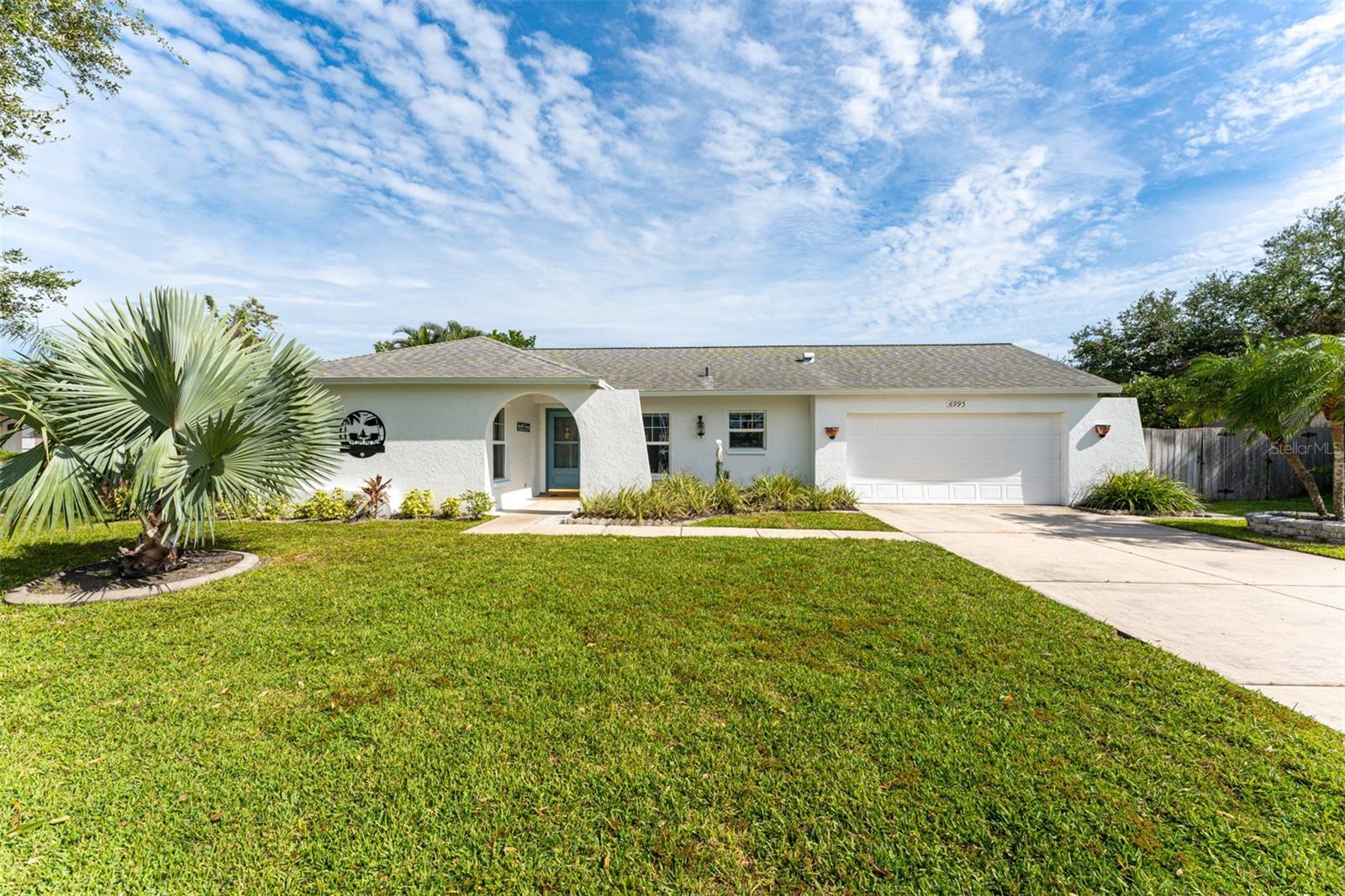 Welcome to the highly desirable community of Gulf Gate East. Don't miss this 3 bedroom 2 bath home with den/office, 2 car garage and screened pool. The home is highlighted by stunning renovations with attention to detail. Luxury vinyl plank flooring throughout and the kitchen/living room has been redesigned with an open floor plan accented by new cabinets, quartz countertops and stainless steel appliances. Newly renovated bathrooms and interior painting throughout, on a large private lot with a lake view make this a must see. New roof 2017, new well pump 2023, pool heater in 2022, pool pump in 2023, new water heater 2024, sewer lines inspected and relined 2024 and an impact rated garage door in 2024. The pool heats to 102 degrees and can be utilized as a spa or plunge pool. The location provides excellent schools, walking and biking trails, fitness centers and more. Easy access to UTC mall and Gulf Gate village to enjoy shopping and a variety of restaurants. Within minutes of our world famous Siesta Key beach and downtown Sarasota featuring fine dining, shopping, the arts district and theater. Schedule your showing today.