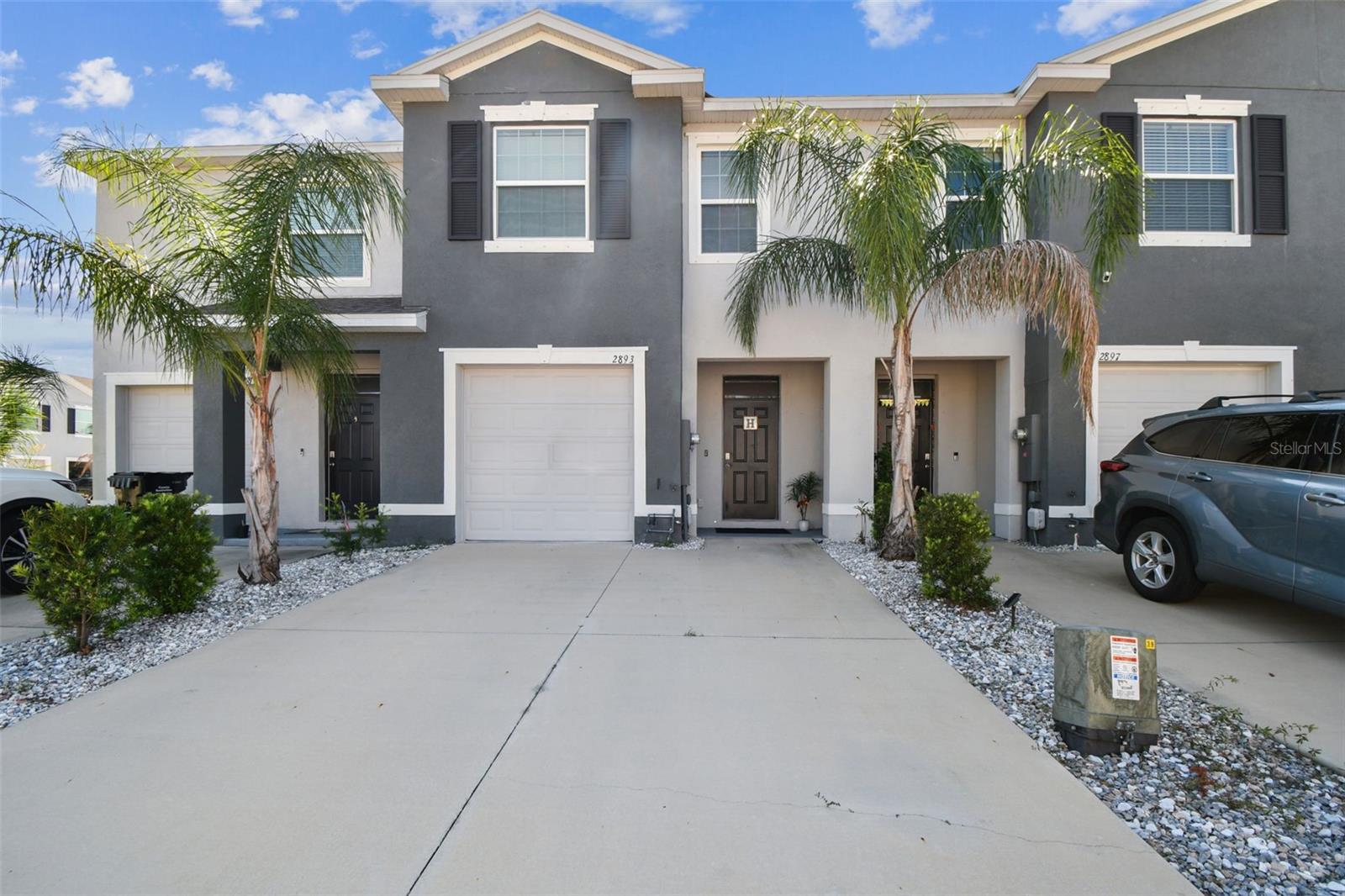 Welcome to The Preserve at South Branch in Odessa! This stunning 3-bedroom, 2.5-bath townhome with a 1-car garage offers the perfect blend of comfort, convenience, and community living. Nestled in the back of the community for added privacy, this home sits in a top-rated school district and is just minutes from the Veterans/Suncoast Parkway, Tampa Premium Outlets, shopping, dining, medical facilities, Tampa International Airport, downtown Tampa, and Florida’s world-famous beaches. Step inside through the inviting foyer and be greeted by a bright, open floor plan featuring ceramic tile throughout the main floor and tasteful upgrades at every turn. The gourmet kitchen is the heart of the home, boasting granite countertops with breakfast bar seating, rich wood cabinetry, stainless steel appliances, a walk-in pantry, and a dedicated dining area. The kitchen flows seamlessly into the spacious living room and out to the screened lanai—perfect for entertaining guests or enjoying quiet evenings at home. Upstairs, retreat to the owner’s suite complete with dual walk-in closets and a spa-like ensuite bathroom featuring dual vanities and a walk-in shower with double shower heads. Two additional generously sized bedrooms with upgraded ceiling fans, a full bathroom, and a convenient laundry closet with washer and dryer round out the second floor. Additional highlights include: Garage with storage racks, bike hooks, water softener, hurricane shutters, extra storage under the stairs, and extended driveway parking for up to four cars. Smart home features including keyless entry, Ring doorbell, thermostat control, wireless garage door opener, motion sensors, and smart lighting. Living in The Preserve means enjoying resort-style amenities, including a clubhouse with fitness center, Olympic-sized lap pool, heated zero-entry pool, sports fields, basketball courts, playground, dog park, walking trails, picnic areas, and private access to the Suncoast Trail. This home offers not just a place to live, but a lifestyle you’ll love.