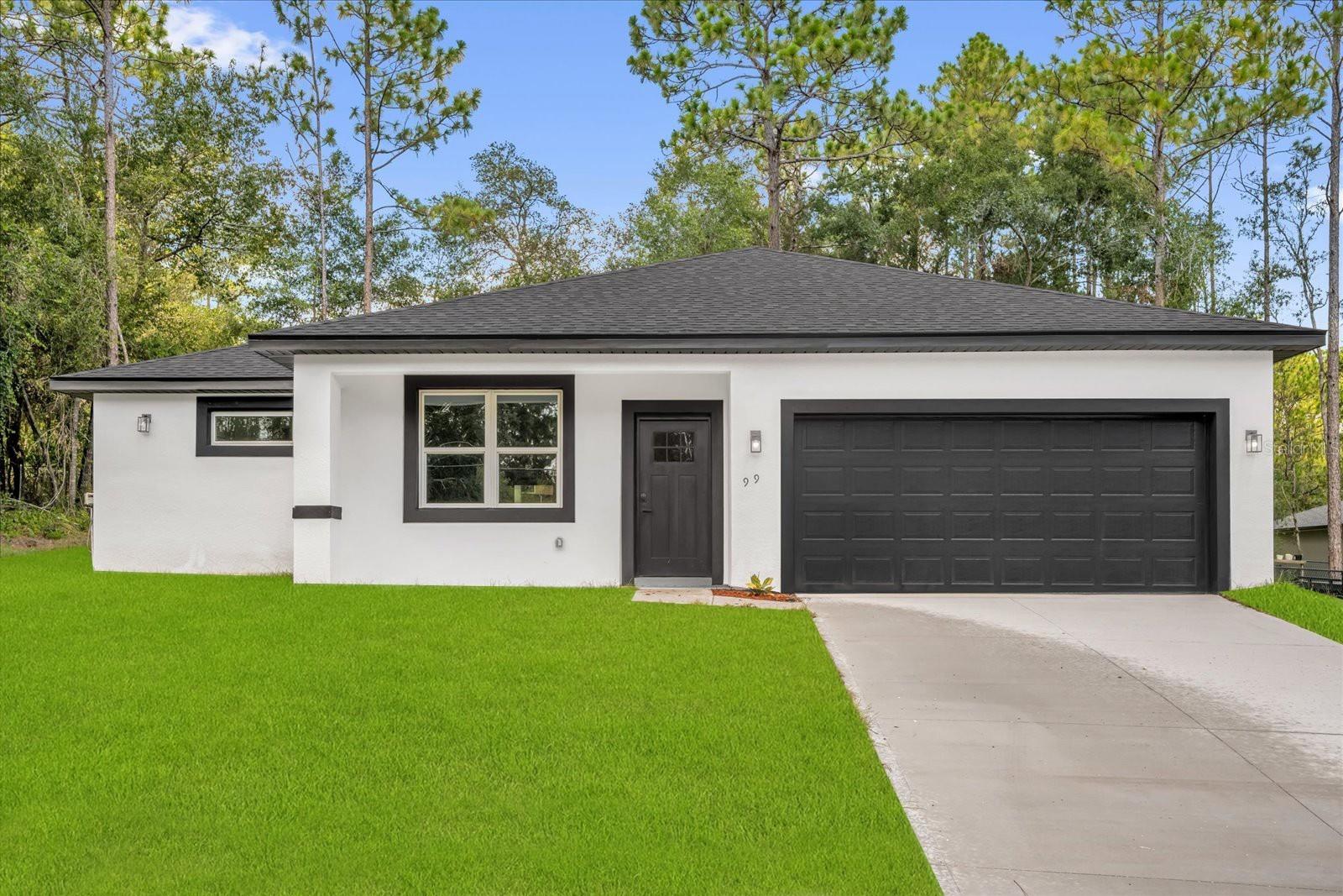 Brand-new modern construction in the desirable community of Citrus Springs! This stunning 4-bedroom, 2-bathroom home blends style, comfort, and practicality for everyday living. The open-concept floor plan is perfect for entertaining, featuring a fully equipped kitchen with stainless steel appliances—including refrigerator, range, dishwasher, and microwave—a large center island, and a spacious walk-in pantry. The private master suite offers a beautifully appointed bathroom with a double-sink vanity and luxurious tile finishes. With 1,548 sq. ft. of heated living space (2,092 sq. ft. total) and a 2-car garage, you’ll enjoy the perfect balance of elegance and functionality. Nestled in a peaceful neighborhood, this home is ready to welcome its first owners.