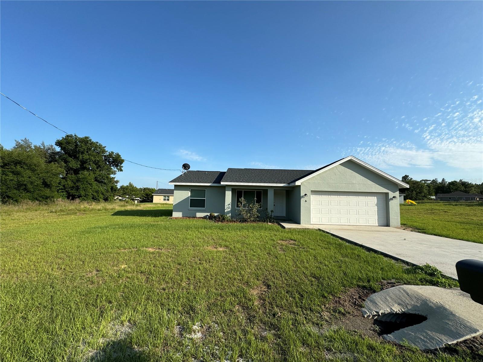 Welcome to your new home in Ocklawaha FL!
This 3 bed 2 bath is simply gorgeous. The living area flows seamlessly into the kitchen with an open concept layout and vaulted ceilings. The kitchen is equipped with all stainless steel appliances including a refrigerator, dishwasher, oven, stove, and microwave for all your cooking needs. The master bedroom has its own personal bath and walk in closet. Both spare bedrooms are spacious with their own closets for all storage needs. Ceiling fans are in every room, and this home has its own septic and well saving you on utility costs! This home also has a spacious 2 car garage to keep your vehicles out of the blistering sun! Come see your new home today!