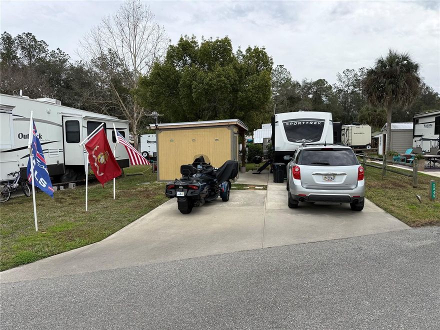 Welcome to Lot 105 in the sought-after waterfront Wilderness RV Resort, located at 2845 NE 104th Avenue in Silver Springs, where resort living meets Old Florida adventure. This beautifully improved lot features a shed with electricity and a handcrafted wooden gazebo built like a tank, complete with substantial 6x6 pillars and a dedicated TV compartment—perfect for relaxing, entertaining, or watching the big game after a day on the water. Wilderness RV Resort offers exceptional amenities including a massive community pool, a well-equipped fitness center with sauna and steam room, recreation room, laundry facilities, convenient mailbox area, and an impressive dog park for four-legged residents. Also a private Lodge for any events or community get togethers. Just outside the park you’ll find a diner and a charming gift shop known for its famous whoopie pies. Enjoy direct access to fishing and kayaking, whether paddling upstream or downstream to iconic Silver Springs State Park, where you can experience crystal-clear waters and unforgettable wildlife sightings including manatees, alligators, and yes—even monkeys. When you’re ready to explore beyond the resort, historic downtown Ocala’s vibrant Square is just a short drive away, offering an exciting mix of restaurants, billiards, live music on weekends, a comedy club, and local favorites like Brick City BBQ, along with the retro Marion County movie theater featuring a full liquor bar. This is more than an RV lot—it’s a lifestyle filled with relaxation, recreation, and true Florida charm.