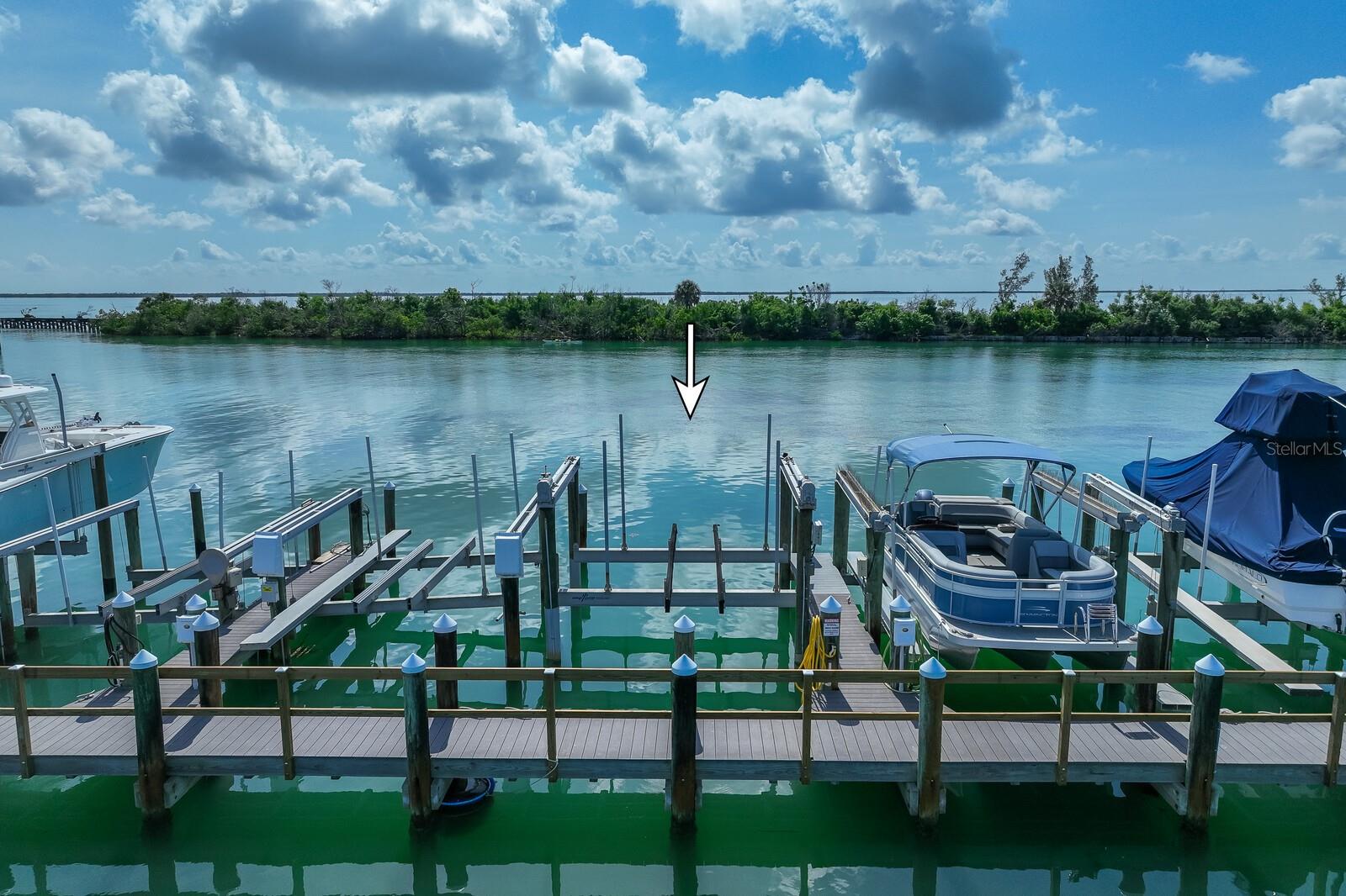 Boca Grande North Marina's slip #55 is the ideal place to keep your boat on Gasparilla Island. Located in the private gated community of Boca Grande North, it is a boater's paradise. This is one of largest slips at Boca Grande North. Easily can house up to 36'. This slip has a new high speed 16,000 lb lift, adjustable to fit any boat. The dock is made of composite material for easy maintenance. This slip is fully deeded, not subleased, and ownership is not contingent on living in the community. Only minutes to the intercostal waterway and the Gulf of Mexico. No bridges and deep water make this the perfect setting to enjoy your boating lifestyle.