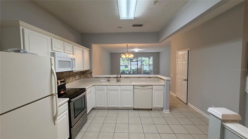 Photo of 3336 Shallot Drive #104, Orlando, FL 32835 (MLS # O6427056)