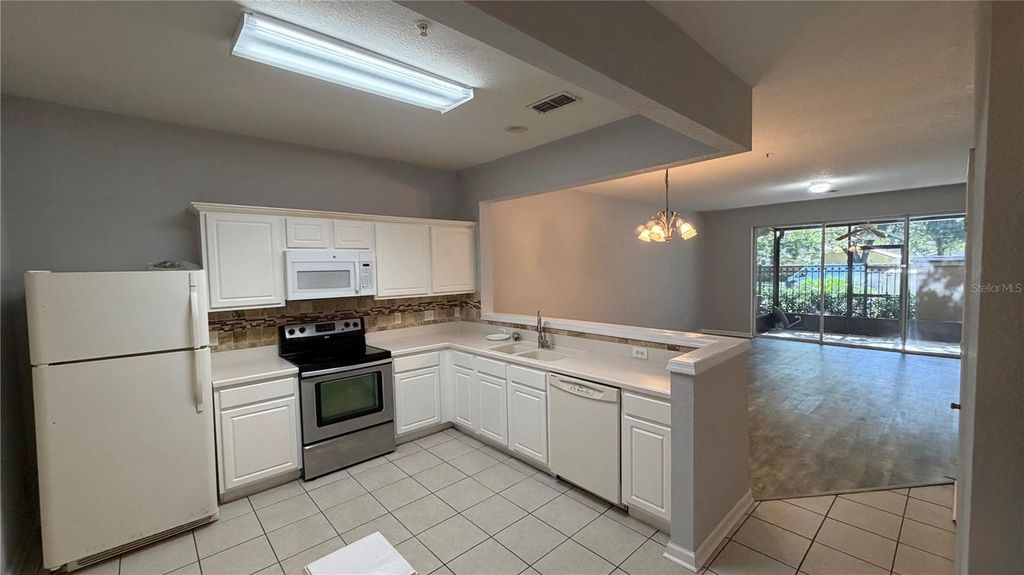 Photo of 3336 Shallot Drive #104, Orlando, FL 32835 (MLS # O6427056)