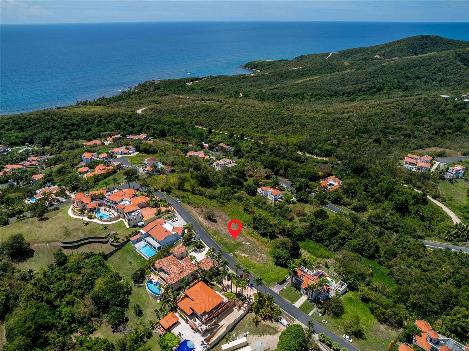 Welcome to one of the most coveted addresses in Palmas del Mar – Ridge Top Drive. This stunning lot spans 1,996.62 square meters and offers an extraordinary opportunity to build a custom luxury estate in one of Puerto Rico’s resort communities. Perched at a high elevation, this homesite boasts breathtaking panoramic views of Vieques, the Caribbean Sea, and the turquoise ocean beyond.
Ridge Top Drive is renowned for its exclusivity and privacy, lined with high-end custom homes and expansive estates. This is your chance to design and build the home of your dreams in a location that combines natural beauty, security, and resort-style living.
Palmas del Mar is a world-class, master-planned resort community offering a wide array of amenities including:
• Two championship 18-hole golf courses
• A state-of-the-art tennis and pickleball center
• Equestrian center with scenic trails
• Private beach club, restaurants, and cafes
• Miles of walking and golf cart paths
• A top-tier bilingual school (K-12)
• Marina & yacht club with offshore excursions
• 24/7 security and gated access for peace of mind
Whether you’re envisioning a full-time residence, vacation retreat, or investment property, this lot offers unmatched value and location for luxury living in Puerto Rico. With sweeping views, exclusive surroundings, and access to exceptional amenities, this is your canvas to create a one-of-a-kind lifestyle. Includes completed soil study and percolation test.