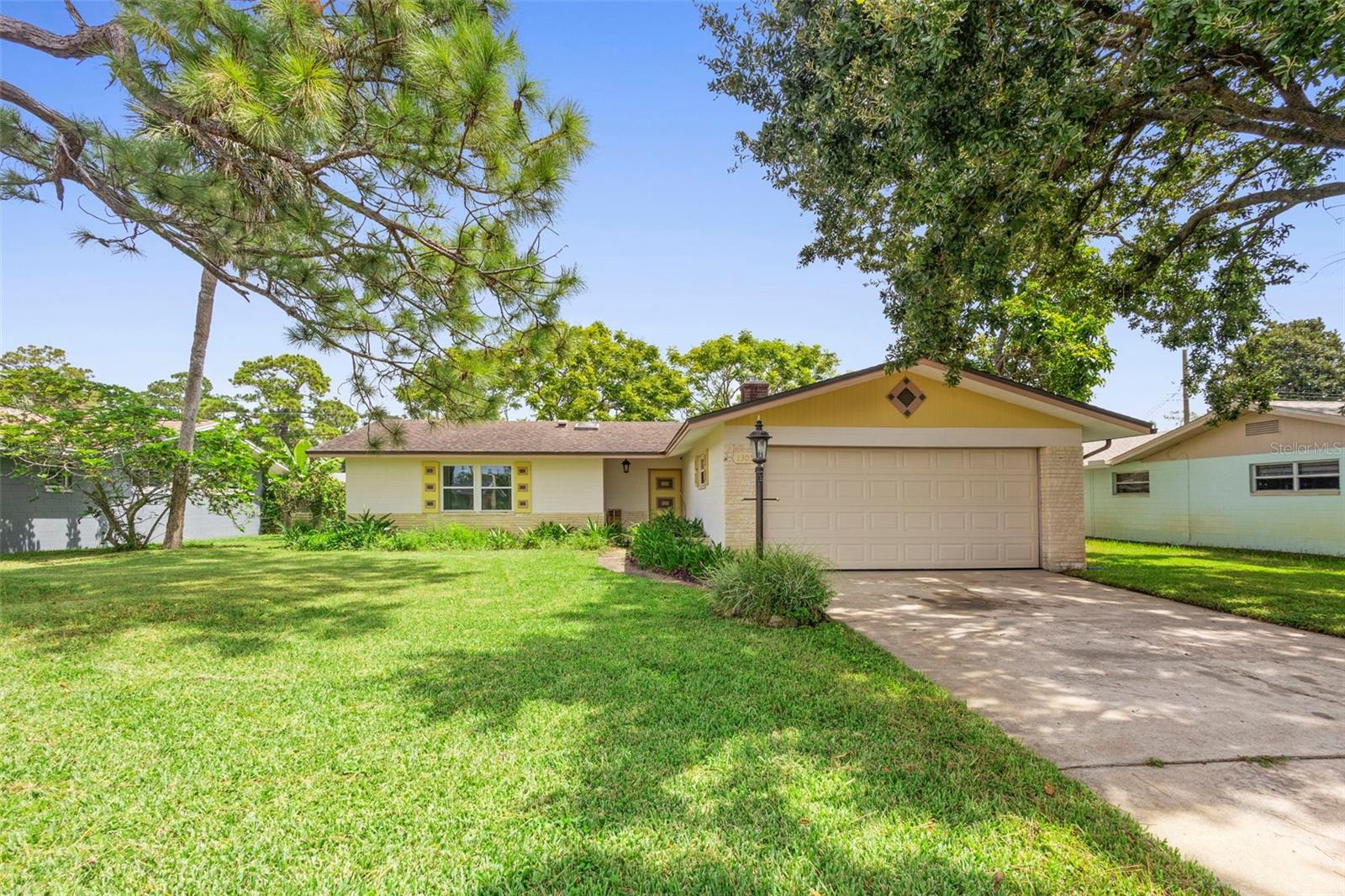 Welcome to this beautifully updated 3-bedroom, 2-bath home in a highly sought-after Daytona Beach neighborhood! Step inside to find a stylish interior with fresh paint, updated lighting, and durable luxury vinyl plank flooring throughout. Peace of mind comes with new hurricane-rated windows and slider (lifetime warranty), a brand-new 200-amp electric panel, and a 2022 HVAC system for year-round comfort. The 2-car garage features a new opener, while the lush, green lawn is maintained by a fully functional irrigation system with a new sprinkler pump. Curb appeal is enhanced with fresh exterior paint, and the home is truly move-in ready. Just minutes from the world-famous Daytona International Speedway, Daytona Beach International Airport, and Embry-Riddle Aeronautical University, this property combines modern efficiency, comfort, and unbeatable convenience. Don’t miss the opportunity to make this updated gem your new home!