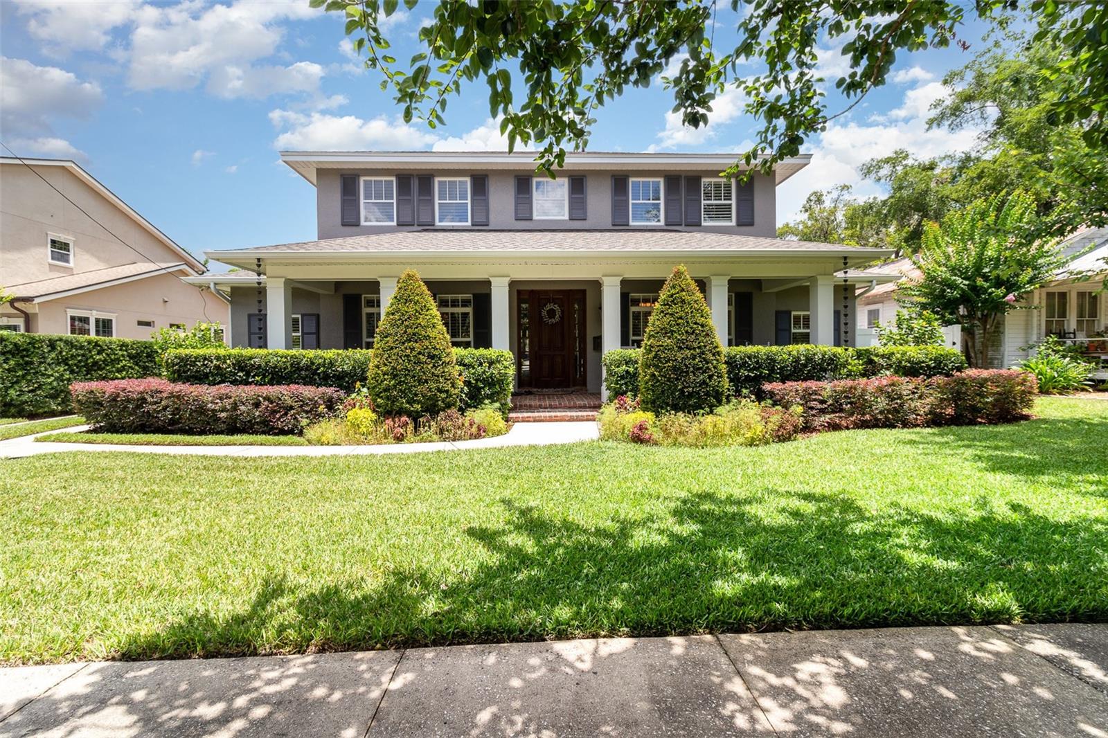 Under contract-accepting backup offers. Welcome to this beautifully crafted 5 bedroom, 5.1 bathroom traditional single-family home offering over 4,100 SF of living space. Ideally located on a tree-lined street with Winter Park’s signature brick roads, this home sits in one of the area’s most sought-after neighborhoods. Just minutes from the Winter Park Racquet Club in the Vias, Park Avenue shops and dining, YMCA, top hospitals, and excellent public and private schools, it offers the best of Winter Park living. A charming front porch leads into a thoughtfully designed interior that blends classic style with modern functionality. To the right of the foyer is a private office with built-in shelving and glass pocket door, while the left opens to a formal dining room with a tray ceiling, chandelier, and ambient lighting. The spacious living room features a gas fireplace, beamed ceiling, crown molding, and built-in shelving, with French doors that open to the screened lanai for seamless indoor-outdoor living. The chef’s kitchen offers ample cabinetry, expansive countertops, a center island with secondary sink, walk-in pantry, and a breakfast nook with more French doors to the lanai. On the main floor, the primary suite includes a spa-inspired bath with double vanities, garden tub, and multiple closets. A guest suite also on the first floor includes a private bath, beverage fridge, and coffee station. A full laundry room and butler’s pantry with wine fridge complete the first level. Upstairs features a large loft with built-in cabinetry, under-cabinet lighting, and a beverage fridge. A built-in desk and cabinets line the hallway for study or work space. Two bedrooms share a Jack and Jill bath, and a third has access to a nearby full bath. A second laundry room, currently used as an office, adds flexibility. Step outside to a private backyard oasis with a screened lanai, sparkling pool, outdoor kitchen, mature landscaping, and full pool bathroom. With a new roof (2023), commercial grade water heater (2022), fresh exterior paint (2024) and many upgrades, this home offers turnkey living in one of Winter Park’s finest communities.
