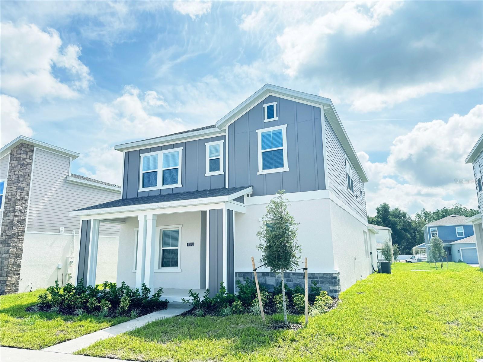 This 4 bedroom and 3 full bathroom home on a 50-foot lot with 2,462 sqft of living space is perfect for families, 1.2g Internet is included! Walking into the front door, you will see a multipurpose room. A bedroom next to a full bathroom. Walking into the middle of the house, you will see an open living, eating, and kitchen area with a modern quartz countertop, a large island, plenty of cabinets, and a walk-in storage space. The second floor includes a loft area for relaxation or entertainment, a master bedroom with an ensuite bathroom, two additional bedrooms with a shared full bathroom, and a laundry room. The house also has a large porch, a double-car garage, and a 4-car driveway. The house is situated in a good school district, which is perfect for families. The location is exceptionally convenient, 3 minutes to Highway 429, 15 minutes to Mont Dora Downtown, and 20 minutes to Downtown Winter Garden, with easy access to major highways and popular destinations.