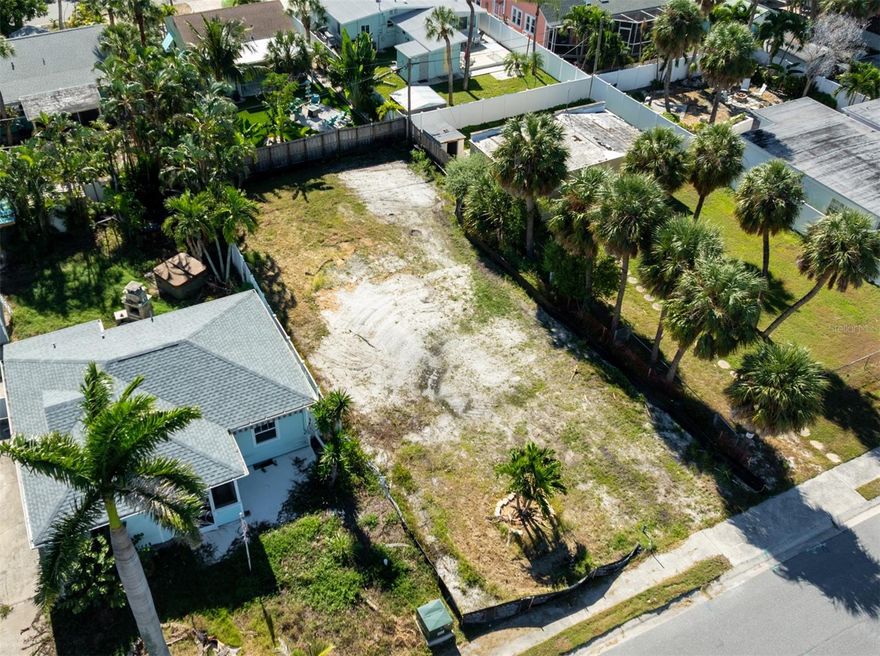 Build your beach dream home in the heart of St. Pete Beach. This ready-to-build lot at 516 78th Ave is just one block away from Blind Pass where dolphins are often seen swimming in the channel. Located a few blocks from the Corey Avenue shopping district, you’ll be walking distance to local favorites like Category 36 Restaurant, The Helm, Grove Coffee, Mastry’s Brewing, and the popular Corey Avenue Farmers Market every Sunday. The surrounding neighborhood is a residential area with golf cart-friendly streets. Commuting off the island is simple with the Corey Causeway just three blocks away, providing quick, direct access to downtown St. Petersburg and the mainland. The lot is fully cleared, leveled, prepped and ready to build. This property is less than half a mile from beautiful Upham Beach, and you can enjoy fishing at the end of the street, paddleboarding or kayaking from nearby Ron McKenney Park just a mile north, or visiting the St. Pete Beach Community Center two blocks away with its lap pool, fitness center, and recreation programs. The Corey Causeway is only three blocks away for quick access to the mainland and Downtown St. Pete. This lot offers the perfect blend of convenience, coastal charm, and opportunity to create your ideal beach retreat with easy access to the city and shore.