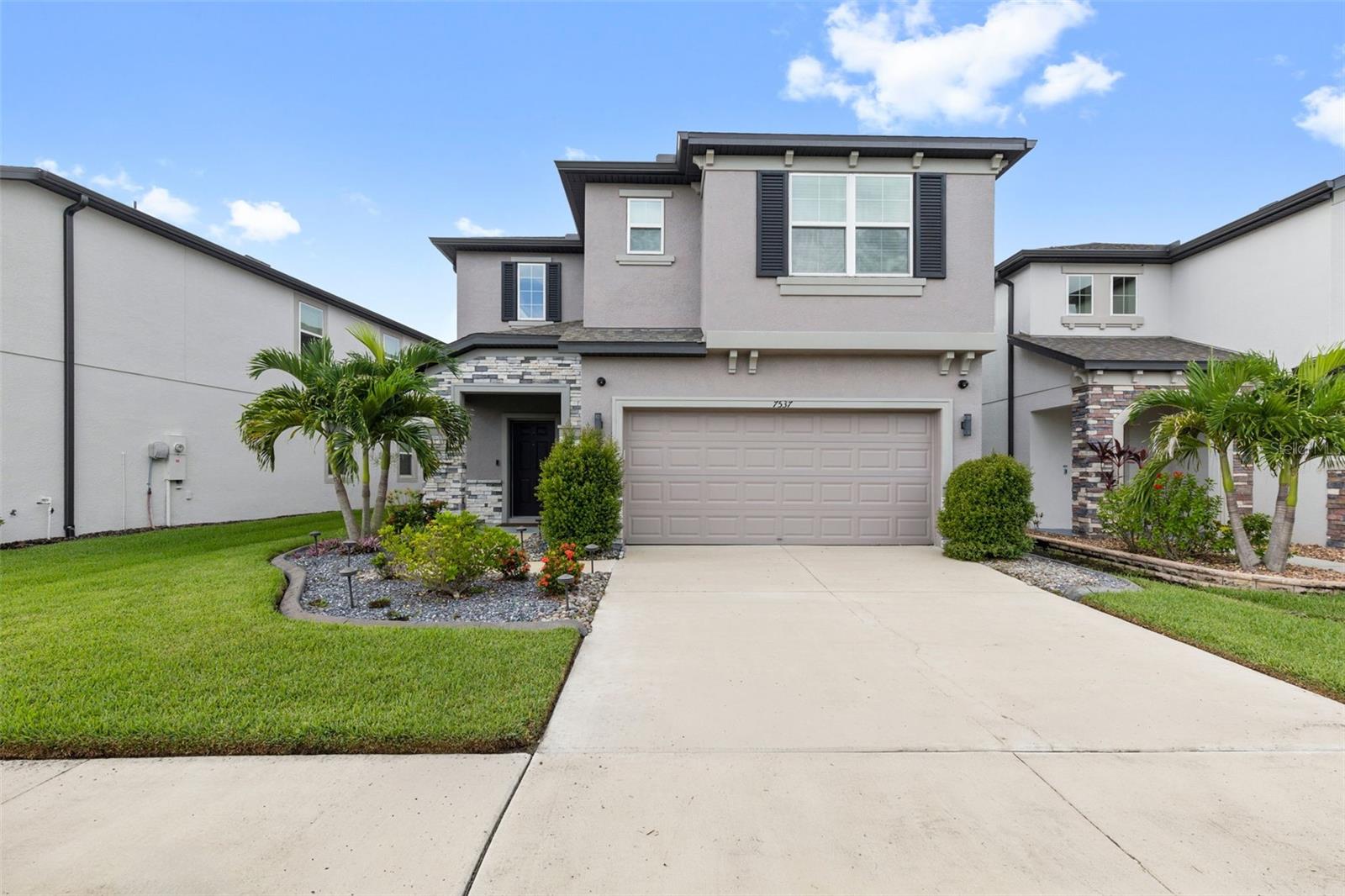 This beautiful 2,500+ square foot, two-story home, built in 2021, offers 3 bedrooms and two and half bathrooms in a spacious and well-designed layout. The heart of the home is a gourmet kitchen with elegant cabinetry, granite countertops, stainless steel appliances, upgraded pantry, backsplash and a large center island – perfect for entertaining. The sophisticated, built-in entertainment center provides a distinguished focal point for your family room. Its design prioritizes both aesthetic appeal and optimal functionality, offering a refined media experience. A generous second-level loft, presenting a flexible and expansive area suitable for a variety of uses. Enjoy the Florida lifestyle on the oversized lanai overlooking a serene pond. Located in the desirable Epperson community of Wesley Chapel, residents have access to resort-style amenities including a crystal lagoon, event pavilions, cabanas, tidal pools, a dog park, swim-up bar, in-water obstacle platform, restaurant, and family beach. This exceptional home also includes some fantastic extras: 500/500 internet service and cable. Schedule your private showing today!
