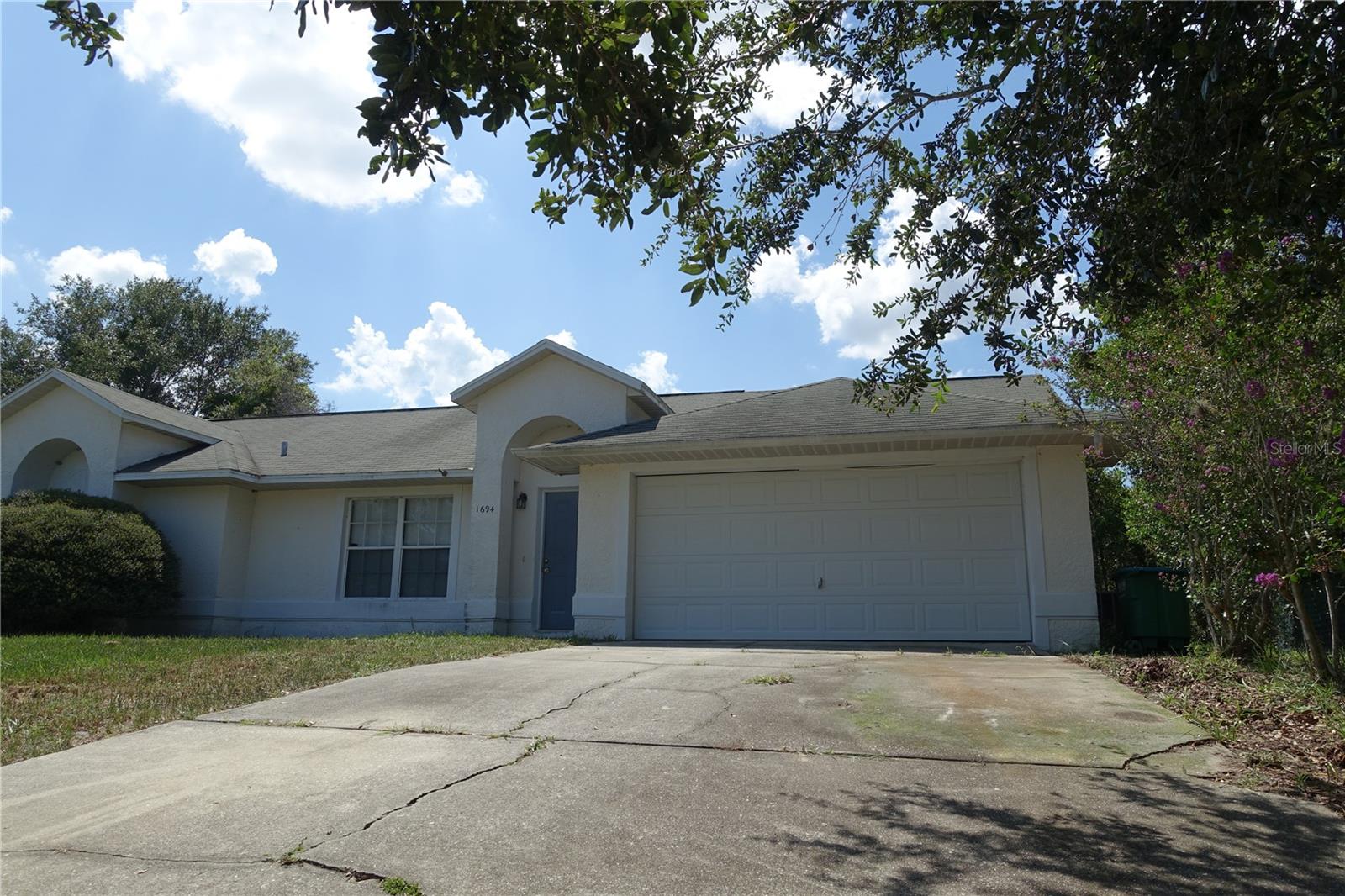 This is a lot of house for the money situated on an oversized lot.Three bedrooms and two baths. An open floor plan with over 1700 square feet and high ceilings create the feeling of spaciousness. Combo living/dining area as well as a family room. This home is close to the I-4 and minutes from our beautiful beaches as well as all the attractions.