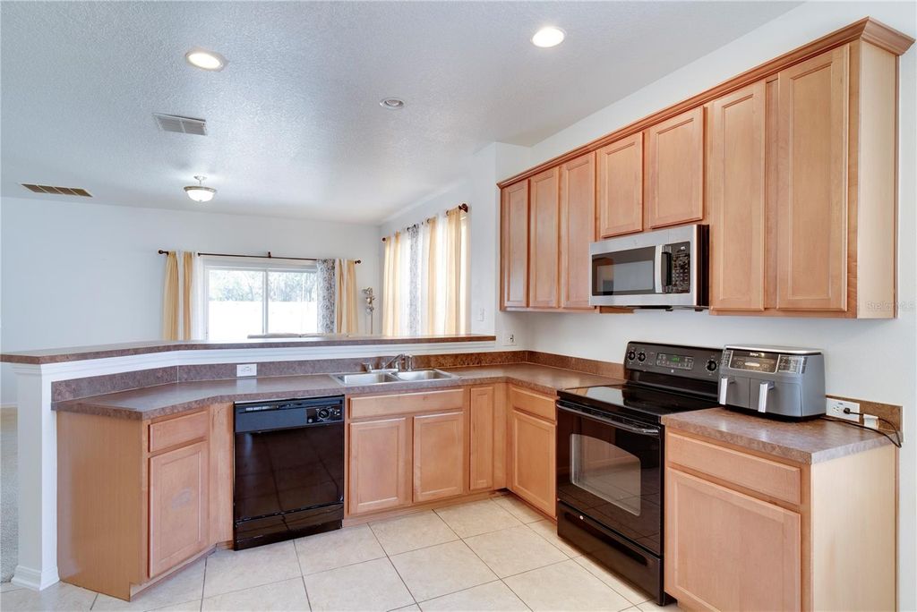 Photo of 7806 Bear Claw Run, Orlando, FL 32825 (MLS # O6386344)