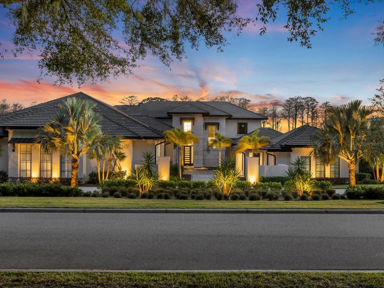 Unsurpassed lakefront luxury custom built from the ground up to exude elegance that you will not find at any other address. Nestled on the pristine shores of Lake Blanche, in the highly coveted guard gated Isleworth Golf & Country Club community of Windermere - welcome to Blanche Cove Drive! This 6-bedroom/8-bath home was masterfully crafted by Stonebridge Custom Homes in 2022 and even the most discerning buyer will feel like they have stepped into the pages of a magazine while touring this thoughtfully designed floor plan. As you step inside, you are greeted by exquisite craftsmanship in the foyer with 24 ft ceilings, and floor-to-ceiling windows, with attention to detail and scenic lake views at every turn. The home chef will fall in love with the state-of-the-art kitchen boasting every imaginable upgrade including a hidden walk-in pantry, Wolf appliances, quartz countertops, a full-size fridge and separate freezer, double wall oven, wine fridge, farmhouse sink and a double island set up made for entertaining. The primary bedroom has sweeping lake views, including a private balcony with invisible electronic screens and a two-story custom master closet, including a hidden shoe room and private laundry. Entertain guests in style with a state-of-the-art movie theater complete with full surround sound, including a custom starry night ceiling to mimic the night sky, a 6,060 sqft NBA full regulation size indoor basketball court; fully air-conditioned and complete with a water refill station and hidden memorabilia/storage room. No amenities were spared with your own private elevator for your convenience, sauna when you need to relax, home gym, an additional bonus space upstairs overlooking views of the basketball court, and the entire house is equipped with surround sound and a full security system. There are two oversized garages with epoxy floors fully A/C’d, one with built-in additional storage space and a separate single-car garage hidden on the side of the home known as the “batman” garage! Step outside into your own private backyard oasis, including a full summer kitchen and bar conveying Wolf appliances, surrounded by electronically controlled invisible screens and a full surround sound system. Sit poolside at your private saltwater pool complete with a sun shelf, water features and infinity ledge paired with the heated spa, including all-encompassing views of the lake and front-row seats to all three Disney Parks nightly firework shows! Watch the sun set on your private dock overlooking the unparalleled beauty of Lake Blanche for endless water views and private access to the highly desired Butler Chain of Lakes. The Isleworth community sets a standard of excellence with the vast array of amenities offered, including its coveted private golf course and having been recognized as one of the Top 100 Platinum Clubs in the world! Call today to secure your private tour and your chance to own this rare opportunity to experience waterfront luxury living at its finest!