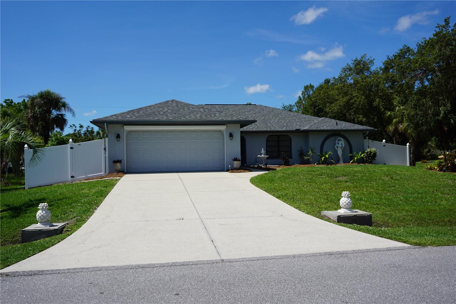 Under contract-accepting backup offers. NEW TO THE MARKET! Whether you're looking for a family home or a vacation retreat, this property has it all with plenty of room for your boat and RV. Nestled in a growing area of Port Charlotte, this 3-bedroom, 2-bath, 2-car garage pool home situated on a half acre (double lots back to back) offers a blend of comfort and modern amenities. It features a freshly painted exterior, new pool cage screens, newer roof (11/2022), whole house Generac generator (2019) with two 120-gal propane tanks to keep you comfortable during power outages, and hurricane shutters for storm protection. Extra blown-in attic insulation including over the Florida room and garage and professionally installed commercial grade window tinting will help you to be energy efficient. There is a 12x30 shed in the back yard for extra storage needs, a culvert was installed for driving in through the separate entrance from the street behind through gates into the fenced back lot, 50-amp RV electric and water hookup, as well as a 220-volt welder electric outlet in the 20x25 covered carport with room for two extra vehicles. Enjoy your backyard setting and swimming year round in the salt water heated pool with southern exposure and extended lanai deck, perfect for entertaining or just relaxing in your private space. There is also an electrical connection for a portable hot tub. Inside the home you’ll find a spacious split bedroom floorplan with a large chef’s kitchen with prep island, plenty of counter space and cabinet storage, with roll-out steel shelving in lower cabinets, under sink RO system and an instant hot water tap at the sink, new faucet, closet pantry, and breakfast bar that overlooks the family room that has sliding glass doors that access the lanai/pool area. The primary bedroom ensuite offers two separate walk-in closets, dual sinks with new faucets and chair height toilet, and a walk-in shower. Washer and dryer hookups in both the laundry room and the garage. The Florida room has access to the lanai/pool area and can also be used for an extra enclosed living space with a separate mini-split wall air conditioner. Convenient location near shopping, restaurants, golf courses, beaches, boat ramps, tennis/pickleball courts, and plenty of opportunities to join fun social activities to meet new people. The home is ready for you to move right in! Schedule your tour today! We can do a quick closing and make this your new SW Florida address soon!