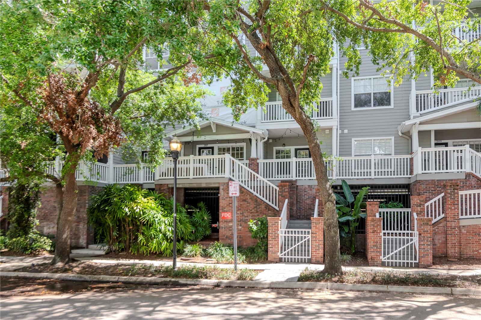 Truly LIVE the URBAN lifestyle in this NEWLY RENOVATED condo located in the heart of Hyde Park Village. This unit is very RARE opportunity as it is one of only six in the entire building with its own private, exterior patio entrance from your condo which is just a few steps to the village! This TURNKEY condo is FULLY FURNISHED with BRAND, NEW, LUXURY furnishings, THREE SMART TV’s, and is READY for occupancy beginning September 1st. This modern, stylish, second floor home is part of “Hyde Park Walk” which is a quiet, gated community located in Hyde Park Village (S. Dakota Ave) directly behind the popular “Meat Market” and “Pottery Barn Kids”. You will love the convenience of being centrally located to upscale shopping, restaurants, coffee shops, co-working space (Hyde House) and more! Just walk downstairs for coffee, cocktails, dinner, a movie, or local weekend events such as art shows and farmer’s markets held frequently in the village. From your door to BAYSHORE BLVD is a short, 7-minute walk for evening sunsets or weekend jogs. RECENT renovations include custom cabinetry (kitchen), GE Cafe' appliances, quartz countertops, updated bathrooms including new vanities and light fixtures, vinyl plank floors, custom molding, custom walk-in “Closets By Design” in bedrooms, recessed and pendant lighting on dimmers, new HVAC, and Samsung washer & dryer. There is also a shut off water valve installed specifically for this unit for peace of mind when traveling. There are a total of three exterior doors in the unit that provide private access to the outdoor gated area. There are also trees surrounding the unit for privacy and shade. Lounge, watch (outdoor) smart TV, or entertain on the patio with clean, modern “Restoration Hardware” furnishings. There is also an al fresco dining area off the patio of the second bedroom or home office. Never look for parking again as you will have your own designated space reserved in the covered parking garage. There are additional community spots for an additional vehicle along with a parking area for visitors or vendors. The building is also entirely secured 24/7…residents must use an access code or a fob to enter the building. Hyde Park Walk building amenities include gated security, pool, outdoor gas grills, business center, on-site property management (during business hours), package delivery room, and bike storage room. All of this is included in the monthly rent price along with the HOA fee which includes trash, water, and grounds/amenity maintenance. Rent also includes high-speed internet, and electricity. There is not cable currently installed but tenant has option to install if they wish, however, there are three smart TV’s and fastest possible WIFI available to easily login into your favorite platforms. Being in the village puts you in the center of the best Tampa Bay has to offer! Close proximity to downtown, Tampa Int’l Airport and gulf beaches truly make this property a hot spot. Please reach out to listing agent for further details or information.