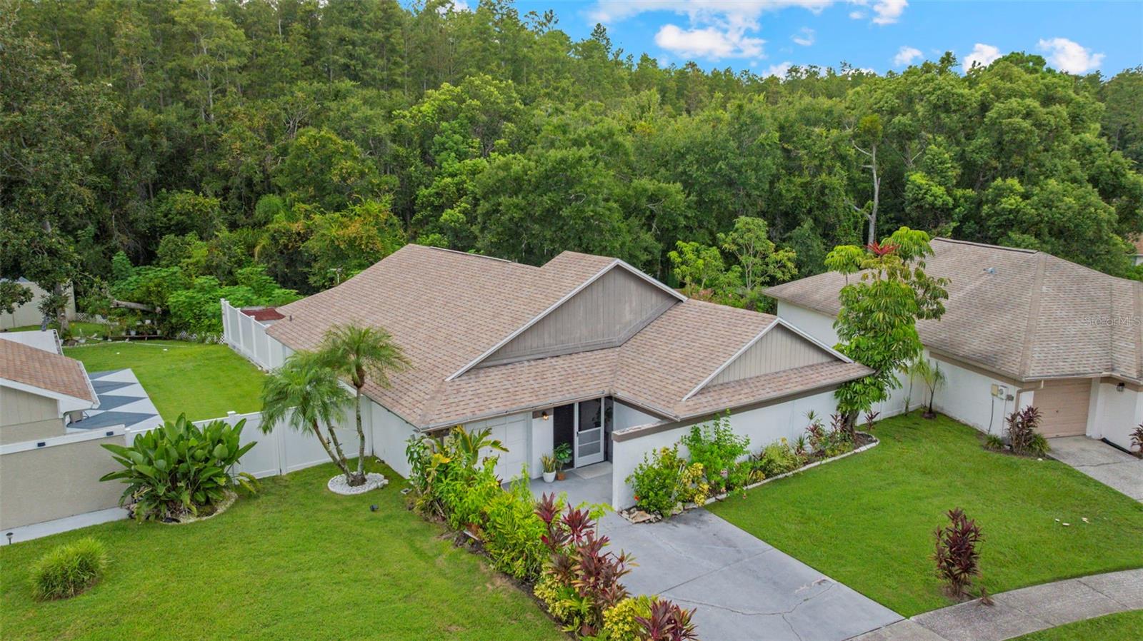 Your dream home with Room to Roam — Indoor/Outdoor Living in Citrus Park, one of Tampa’s most desirable areas—just minutes to the airport, Raymond James Stadium, and all the vibrant energy of Ybor City and downtown. If you are a creative spirit or just demand more space, then welcome to 11815 Hickorynut Drive, a spacious canvas tucked away in the heart of Cedar Creek at Country Run — where nature meets opportunity. This 3-bedroom, 2-bathroom home sits on over a quarter acre of privacy, backing up to a peaceful conservation area. Whether you're dreaming of a garden oasis, a workshop, or a backyard haven, this property is ready for your vision. Generous 2,300 sq ft layout with split floor plan — perfect for customizing zones for work, play, and rest. Multiple living areas including a Living Room, Dining Room, and TV Room — ideal for reimagining open-concept flow.
Large kitchen with potential to open up to the dining area and add a breakfast bar or counter seating.
Indoor laundry room and converted garage space for storage, hobbies, or future expansion. Step outside to your MAGICAL BACKYARD — a fully fenced sanctuary with a covered porch that begs for al fresco dinners, morning coffee rituals, or weekend BBQs. With views of the protected wildlife preserve, you’ll enjoy the best of Florida’s mild winters and lush surroundings.
This home is warm, welcoming, and full of options. Whether you're updating finishes, opening up walls, or adding your own flair, the bones are solid; plus a Newer AC (2022); Appliances just 2–3 years old; Roof only 8 years old.  Just minutes from Publix, dining, and shopping, plus quick access to the Veterans Expressway for easy trips to Tampa International Airport, downtown Tampa, and Armature Works. If you're looking for a home that lets you live large indoors and out — while giving you the freedom to make it truly yours — Hickorynut is calling. Bring your toolbox, your imagination, and your love of nature. This is more than a house. It’s your next adventure.