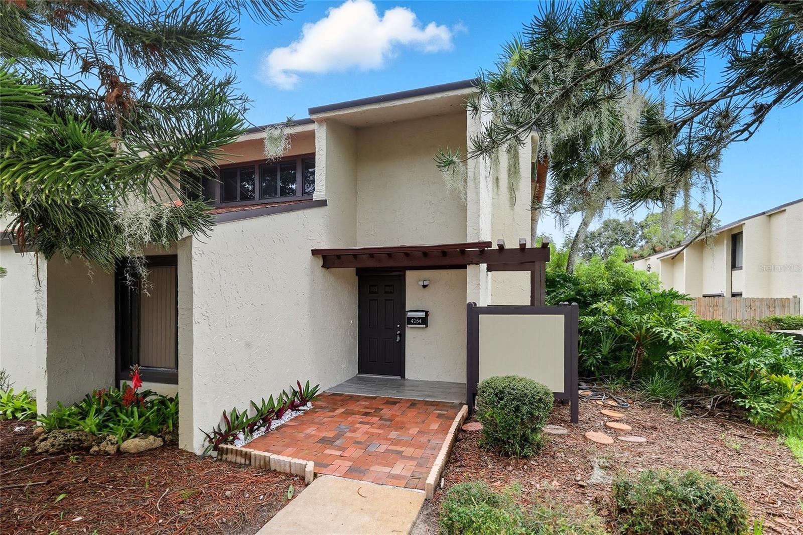 Fully renovated 2+ bedroom, 2.5-bath end-unit townhouse, turnkey and move-in ready with high-end custom finishes (2022–2025). Upgrades include a new roof, plumbing, electrical with service panel and surge protection, A/C with ducting, filtered tankless water system, drywall and paint, hurricane-impact windows, and 9-ft sliding doors. The open-concept kitchen features porcelain countertops, lighted cabinetry, stainless steel appliances, and LED lighting. Three fully renovated bathrooms, polished aluminum staircase, new patio pavers, lush landscaping, storage shed, and outdoor BBQ area complete the home. End-unit with privacy, community pool, clubhouse, and HOA $587/month. Minutes to Downtown Winter Park/Orlando, 25 minutes to Disney, and 50 minutes to beaches and cruise ports. Ideal for homeowners or investors.