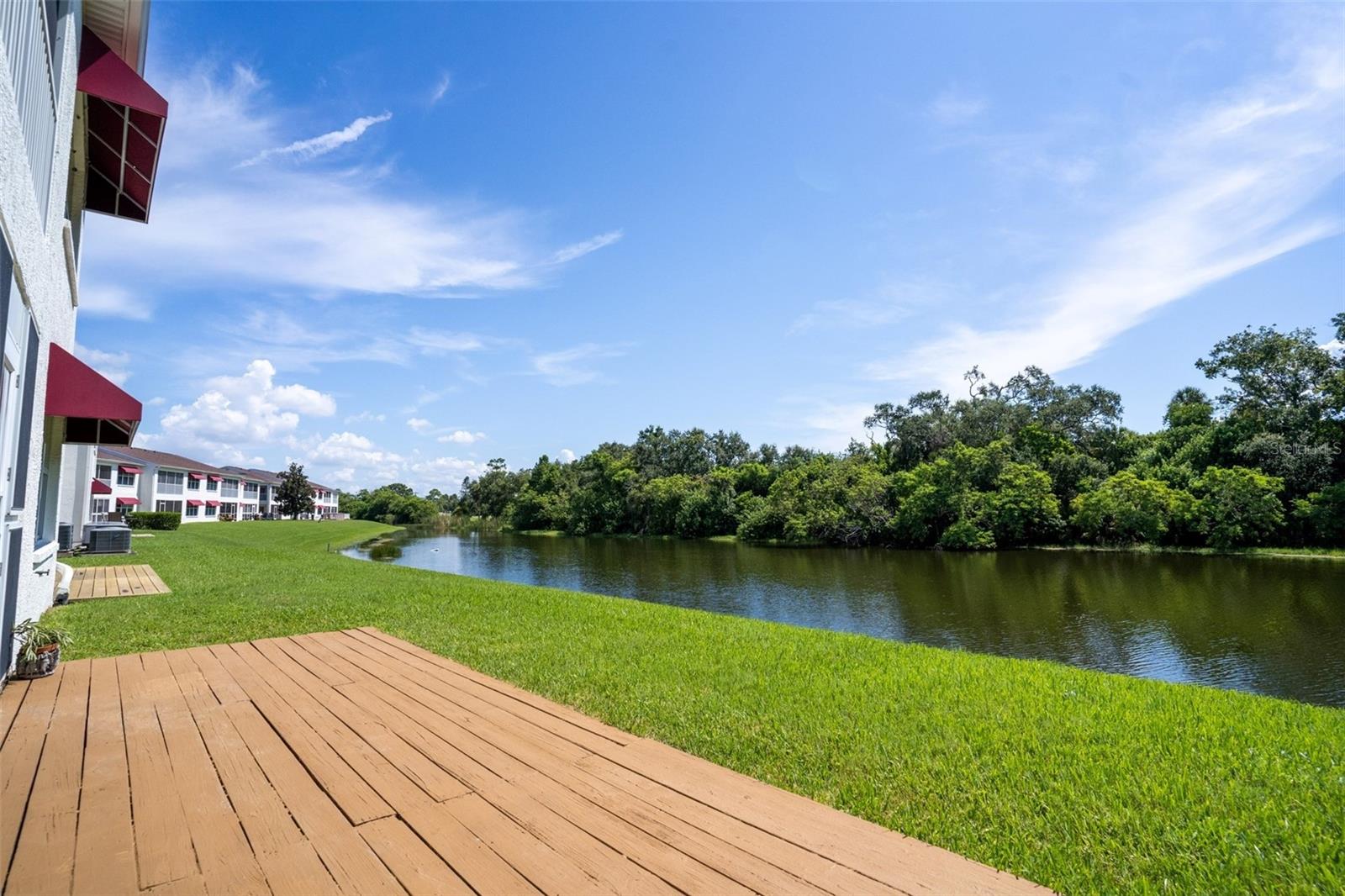 Picture yourself at the dawn of a new day, coffee in hand, soaking up the morning sun in complete privacy with no rear neighbor. As herons glide gracefully across the pond outside your 7' x 20' rear lanai and porch you can find your peace. Tucked away from the bustle, this hidden 40-unit gem of a condominium community offers the perfect blend of serenity and seclusion—so well hidden you might miss it if you weren’t looking.
Built in 2002 and cared for as if new, this home boasts a recently remodeled kitchen. The spacious breakfast area overlooks the lush landscaping and sparkling water. Expansive windows, and luxury flooring create a bright, airy, low-maintenance interior.
The split-bedroom floor plan maximizes privacy, with the oversized primary suite featuring tranquil lake and conservation views, a walk-in closet, and a remodeled ensuite with a glass shower and generous storage. Two additional bedrooms offer versatility for guests, office, or den space.
This rare unit includes its own private garage with ample storage. New water tank, newer AC. The community features a sparkling pool just steps away, plus green park spaces perfect for leisurely strolls. With easy access to beaches, shopping, dining, and airports, this hidden gem offers the best of peaceful lakeside living with the convenience of being close to it all.
Stop searching—start living the waterfront Florida lifestyle you’ve always dreamed of. ** All Information Is Deemed Accurate - Buyer To Verify **