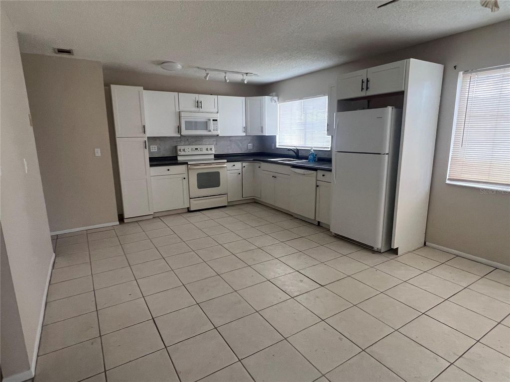 Photo of 334 Aylesbury Lane NE, Port Charlotte, FL 33952 (MLS # C7513778)