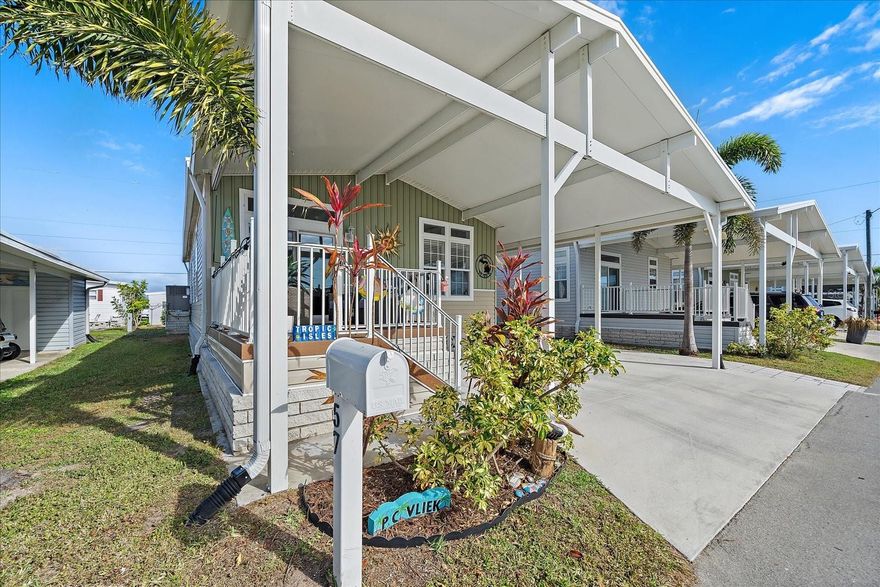 Welcome to this beautifully maintained 2020 Jacobsen manufactured home located in the highly desirable Tropic Isles Co-op. Featuring 9-foot ceilings with crown molding throughout, this natural light-filled home offers an open-concept layout seamlessly connecting the kitchen, dining, and living areas—perfect for everyday living and entertaining.
The home includes double-pane windows, a spacious primary suite with walk-in closet and private bath, a comfortable guest bedroom, and an inviting open porch ideal for enjoying Florida breezes. Additional highlights include indoor laundry, an attached storage shed, and thoughtful upgrades throughout. Opportunities like this are limited—schedule your private showing today.