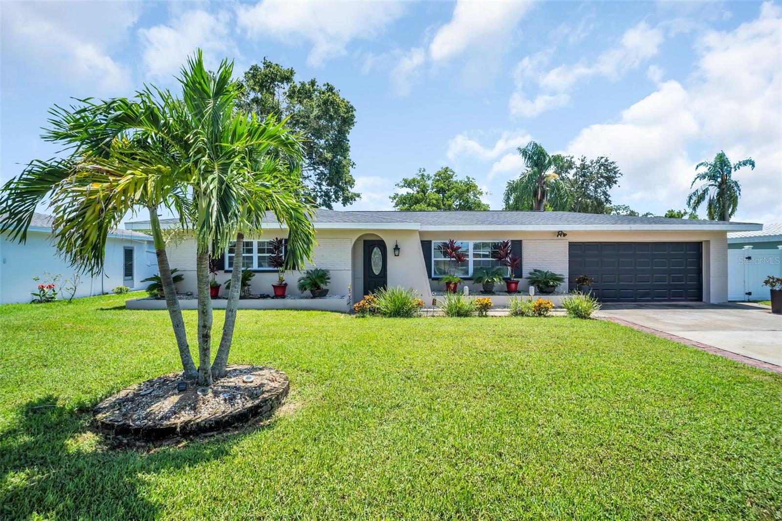 Location, location, location! This fully renovated 3-bedroom, 2-bathroom Clearwater home offers the perfect blend of modern updates, spacious design, and prime convenience. Situated on a generous 8,000 sq ft lot in a high-and-dry neighborhood, this property stands at an impressive 63-foot elevation—NOT in a flood zone and NOT in an evacuation zone—providing peace of mind along with style and comfort.
The current owners have invested over $130,000 in updates, making this home truly exceptional. With 1,658 sq ft of living space, the open concept design showcases a desirable split-bedroom floor plan. The enormous primary suite is a retreat in itself, complete with a large walk-in closet and a beautifully renovated en-suite bath featuring a walk-in shower and contemporary finishes. On the opposite side of the home, two spacious guest bedrooms and a fully remodeled guest bath provide comfort and privacy for family or visitors.
The heart of the home is the renovated kitchen, featuring shaker-style soft-close cabinetry, subway tile backsplash, stainless steel appliances, breakfast bar, and a large pantry—perfect for everyday cooking or entertaining. Throughout the home, new laminate and tile flooring flow seamlessly, while modern light fixtures, LED ceiling fans, and fresh interior and exterior paint create a move-in-ready atmosphere.
Major system updates add to the value and peace of mind:
Roof (2021)
HVAC system (2017) with NEW ductwork and insulation (2023)
Water Heater (2015)
Eaton electric panel (2018)
Numerous hurricane-rated windows and doors for safety and efficiency
Step outside to your own private backyard oasis. The resurfaced and retiled pool (2024) is surrounded by brand-new pavers, a new pool heater, hot tub, and pergola—perfect for relaxation or entertaining. New landscaping, a fenced yard, and a new well, well points, and sprinkler system complete the outdoor retreat.
Additional features include a spacious 2-car garage with ample storage, included washer and dryer, and two sets of keys with a garage door remote. With no HOA and no flood insurance required, ownership here is simple and worry-free.
All of this in a prime Clearwater location! You’re just 1/2 mile to the Pinellas Trail, 1 mile to Downtown Dunedin and Edgewater Park, 5 miles to Clearwater Beach, and 7 miles to Honeymoon Island. Shopping, dining, medical facilities, and entertainment are nearby, making this an ideal home base for both everyday living and enjoying the best of Florida’s Gulf Coast.
With its extensive updates, elevated lot, prime location, and resort-style backyard, 2019 Magnolia Drive is one of the nicest homes you’ll find in Pinellas County at this price point. Don’t miss your opportunity—schedule your private showing today!