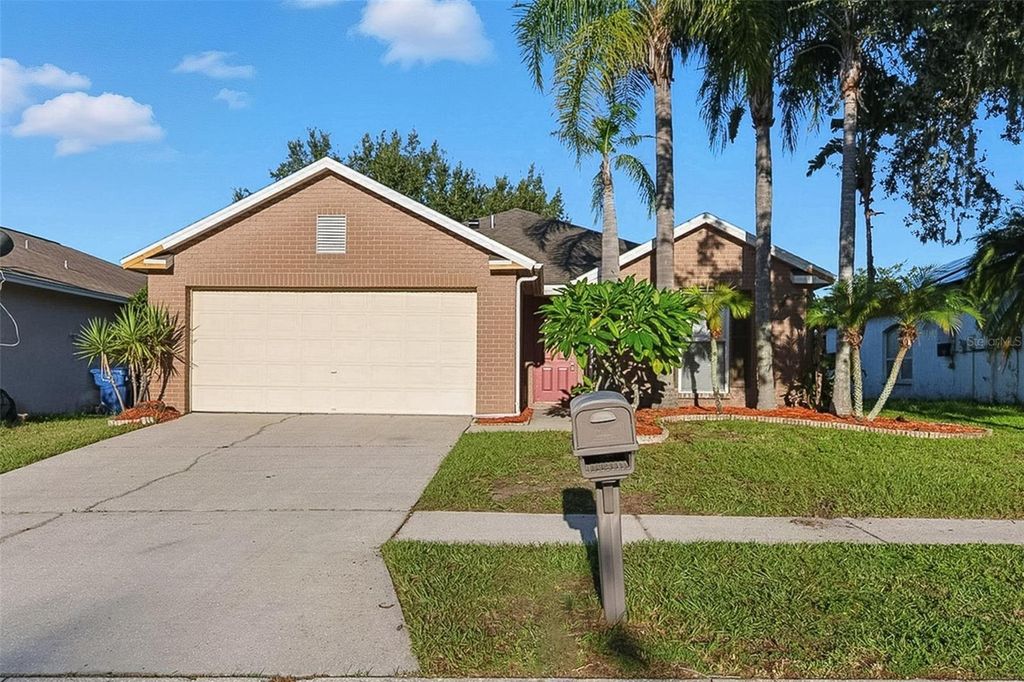 Photo of 1921 Tinker Drive, Lutz, FL 33559 (MLS # O6333562)
