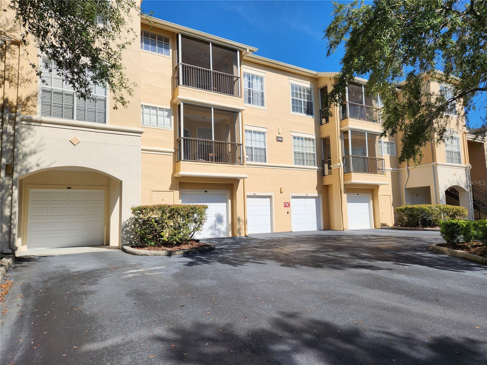 Rent a luxurious condo nestled in the highly desirable community of Oxford Place in Tampa Palms. Tampa Palms is a quiet, upscale suburb of Tampa with close access to the University of South Florida (USF). This 1st floor well-maintained 2 BR, 2 bath condo has a lot to offer. The updated kitchen features stainless steel appliances, elegant back splash, solid surface countertop and wainscoting panel to front the eat in bar area. You will find beautiful wood laminate floors throughout with tasteful selected title flooring in the wet areas. The thoughtfully designed split floor plan ensures privacy and comfort, featuring two master suites, each with its own en-suite bathroom and lots of closet space. There more, this condo has a laundry room with a washer and dryer, a relaxing cover screen lanai with conservation view and a 5 X 5 interior storage closet plus a one car garage. Next to the gated security, you and your family will enjoy a genuine first-class resort atmosphere community center. Take a dip in the resort-style swimming pool with fountains, work out in the state-of-the-art fully equipped fitness center, gather in the clubhouse's social gathering room, enjoy the sand volleyball court, take your dogs for a walk in the designated space, and take advantage of the on-premises car wash with a vacuum, tire pressure hose, and 4 EV charging stations. There's also a playground, on-site BBQ grills, and a valet trash service. fully fenced and gated and is accessible only by gate reader or permission of the gate guard. Just minutes away from I-75, approx. 30 minutes from Tampa Airport and Downtown Tampa. This location puts you within reach of numerous shops, restaurants nearby, at Wiregrass Mall, and more countless dining and shopping, Flatwoods Park for walking, rollerblading, biking and running trails, USF, USAA, Advent Health, Moffitt Cancer Center.