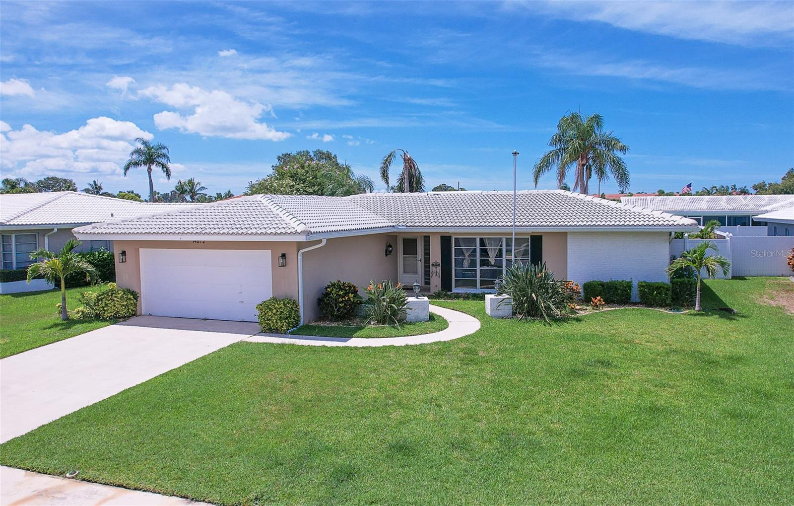 Welcome to Imperial Point, a community offering the true Florida Lifestyle. Well maintained two bedroom two bath Florida style home. As you enter through the front door an expansive Living Room and Dining area are on your right, featuring a large window that bathes the room in sunlight. Straight away is a galley kitchen appointed with GE Profile stainless steel appliances and ample cabinets. Through the kitchen is a large great room perfect for relaxing and still close to the kitchen. From the entry hallway on the left is a second bedroom and full bath, perfect for guests. On the right is the primary bedroom with its walk in closet and ensuite bath with a unique multi-jet shower. Two sets of sliding glass doors lead to a large Florida Room for year round use. A new vinyl fence encloses the backyard. A beautiful gazebo with a bar seating and a stacked stone planter creates a beautiful oasis perfect for relaxation or entertaining.
Imperial Point offers a sparkling heated pool right on the Intracoastal Waterway, boat ramp, tennis and pickleball courts, playground and volleyball adjacent to the neighborhood Club House with a fully equipped kitchen, game room and expansive areas to entertain your guests. Located mere minutes from Indian Rocks Beach, shopping and excellent public services.
