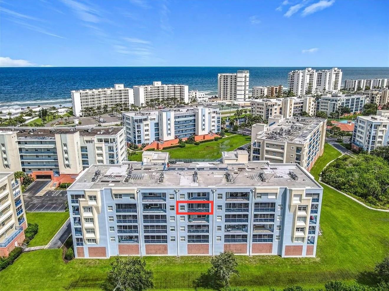 Step into luxurious coastal living with this stunning 3-bedroom, 2-bath 5th-floor beach condo. Enjoy sweeping 180-degree of private unobstructed estuary views with stunning sunsets, plus ocean-peak views from the front of this unit. The Ocean Tide floor plan provides a spacious layout with over 1,700 square feet of comfortable living space. Property comes with a brand new Coastal furniture-package, brand new onyx stainless steel LG washer and dryer, high end onyx stainless steel kitchen appliances, upgraded ceiling fans and light fixtures, 9-foot ceilings, custom built closet organizers in each bedroom, large laundry room with utility tub, and upgraded Zebra window shades. The screened-in balcony has been tiled and comes with Coolaroo sunshades. New HVAC from 2024. All assessments paid. Elevator in building. This beautifully appointed retreat is turn key, move in ready so you can start enjoying the beach lifestyle. This unit has never been rented. Ocean Walk amenities include two heated pools, two fitness facilities, hot tubs, lighted tennis courts, barbecue area, shuffleboard, bocce ball and a nature walking trail. The community also provides garage parking, two secured gated entrances, and easy access to private walkover to the no-drive beach.