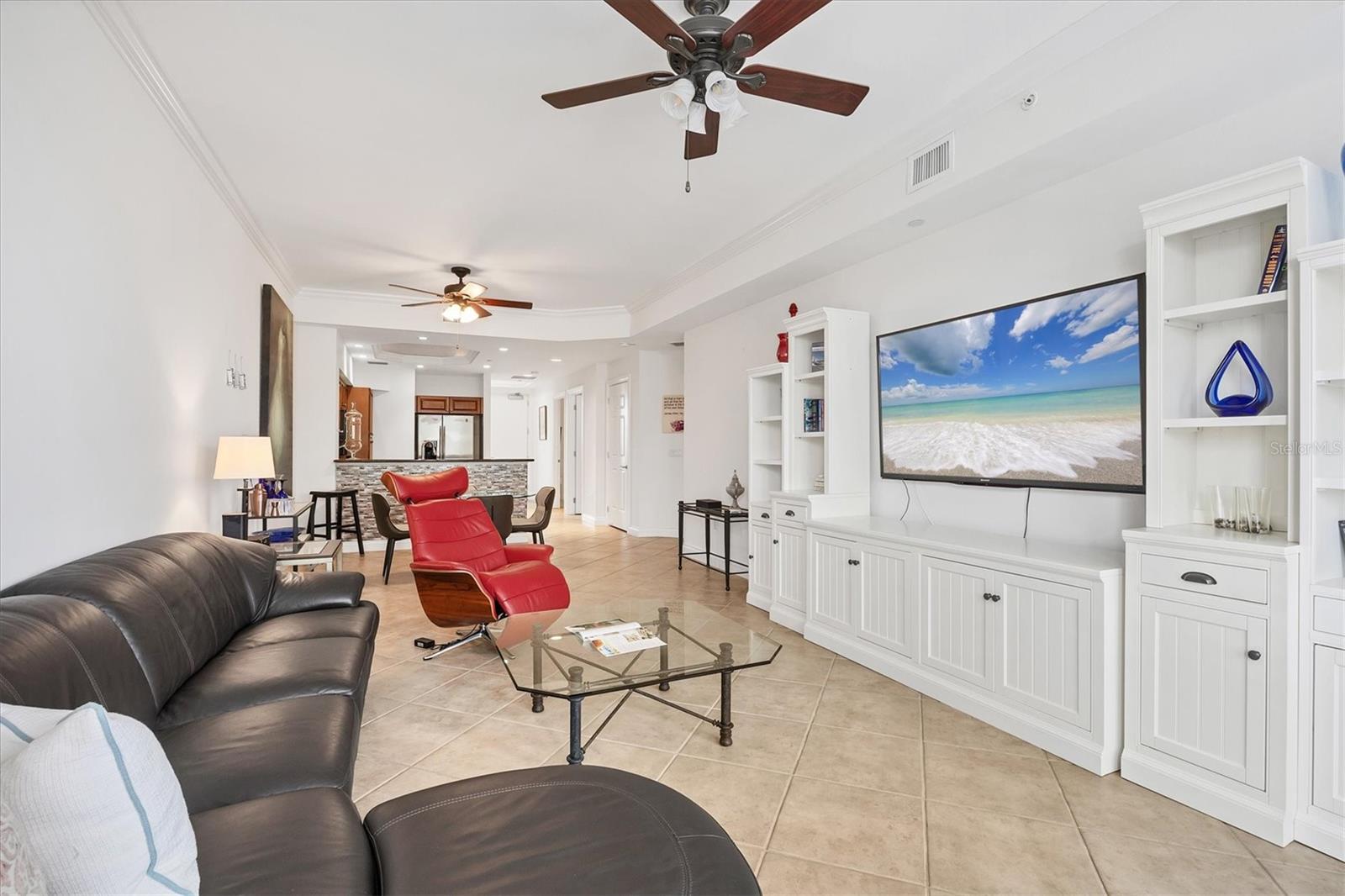 Walk in and be instantly impressed by the quality furnishings, exceptional comfort, and pristine cleanliness of this beautiful condominium, conveniently located in the heart of Lakewood Ranch’s Main Street district. Take the elevator to the third floor and enjoy charming views of Main Street right from your home. You’ll be living in the heart of a vibrant small downtown community, surrounded by popular restaurants, a movie theater, a mini golf course, shops, gyms, and more. Lakewood Ranch Medical Center is just across the street, making this location ideal for both short and long stays. The unit offers an assigned parking space, with additional public parking available if needed. Inside, you’ll find everything you could possibly want, including a private primary bedroom with a king-size bed, walk-in closet, and a spacious en-suite bathroom with double vanities, a walk-in shower, large linen closet, and a private water closet. The guest bedroom also offers a walk-in closet, en-suite bathroom, queen-size bed, and TV. The fully stocked kitchen has everything you need to prepare meals, even a full Thanksgiving dinner. The comfortable living room, furnished with luxurious Italian leather reclining furniture, a large TV, and a glass-top desk, is the true heart of the home. This home consistently earns 5-star reviews from every guest. Come stay with us—we promise you will be delighted with your experience.