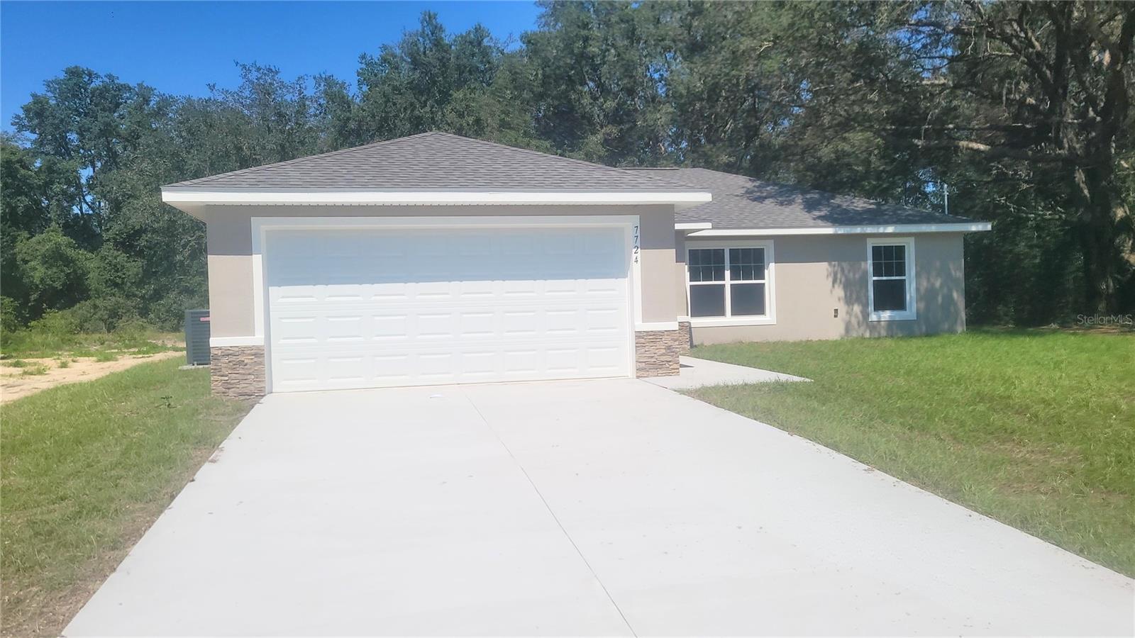 One or more photo(s) has been virtually staged. Beautiful new construction home in Citrus Springs! Located just a minute away from the Trail Head on the Withlacoochee Riding Trails. River access and waterfront restuarants surround this area. This house is move-in ready on a paved street with cute neighbor houses and on a water line! Luxury Plank Vinyl flooring throughout all living and common areas, tile in bathrooms, and carpet in the bedrooms. 3 bedroom, 2 bath ,open floor plan with dining area and eat-in kitchen, all done in neutral, pleasing colors. Inside laundry with W & D hook-ups. Walk-in closet in Master bedroom. Stainless steel appliance package in the kitchen. Cabinets are white shaker-style with light luxury granite countertops. Please see attached documents from Builder (Builders Contract Addendum & Warranty) Actual photos attached + virtually staged model home photos for reference. Any photos depicted are for illustration purposes only and only to show layout. Floor plan displayed is our standard plan and garage orientation may vary on actual home. Interior and exterior colors, finishes, and garage orientation will vary for actual home. Information is deemed correct, but no guarantee made. Any dimensions listed are approximate.