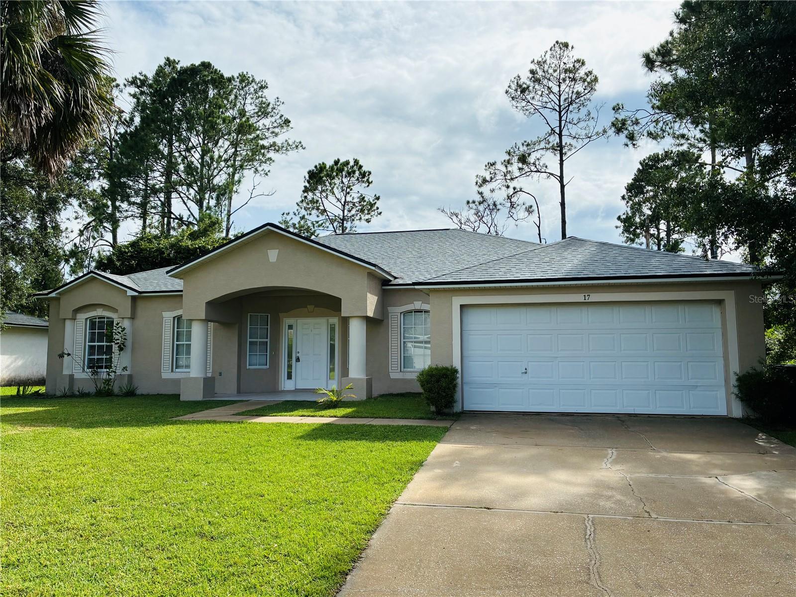 Beautiful one-story home offering over 2,200 sq ft of living space! This spacious property features 3 bedrooms, a separate loft/office space, 2 full bathrooms, and a 2-car garage with an automatic garage door opener. Tile flooring extends throughout the common areas, with laminate flooring in all bedrooms. The large open kitchen includes a cozy sitting area and is equipped with a water purification system—an added health benefit. The home also features a formal dining room as well as a combined living and dining space, perfect for entertaining. The master suite includes a generously sized bedroom, a bathroom with both a walk-in shower and a garden tub, and an oversized walk-in closet. Both guest bedrooms are spacious and bright. The large, private backyard provides a perfect space for children to play or for outdoor relaxation. Great location—conveniently close to schools, churches, and I-95 access