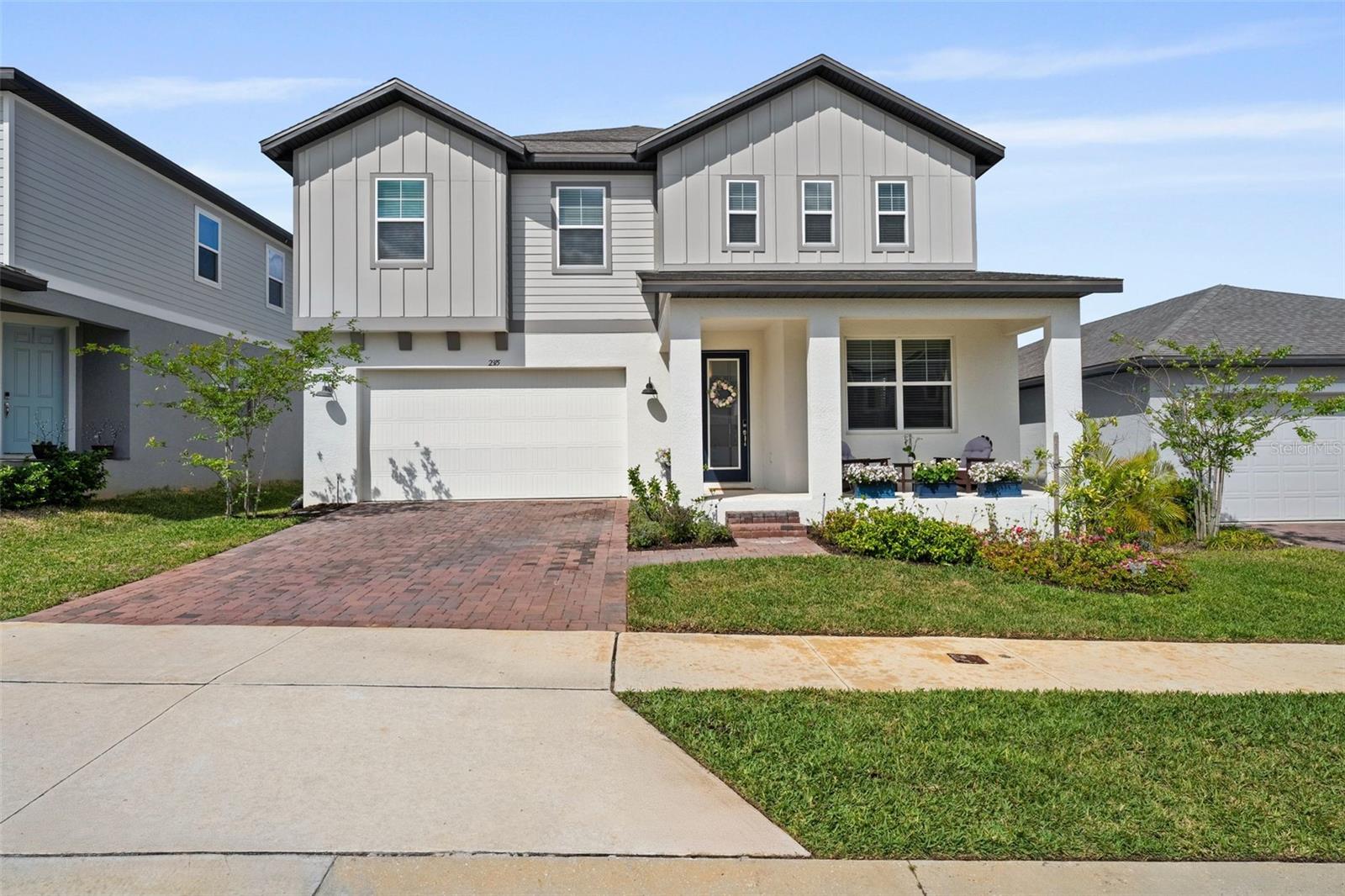 Nestled within a flourishing new community, this 5 bed(s), 4 bath(s) residence is 3,532 sq. ft of thoughtfully designed $100K+ in upgrades. Once inside, you’ll notice a spacious chef’s kitchen w/ butler’s pantry, GE Café appliances, designer light & plumbing fixtures, elegant living & dining areas, shaker cabinets throughout, and wide plank floors. Natural light fills every room, creating a stunning, expansive, and serene atmosphere. No detail has been spared; walk-in closets, plantation shutters, built-in dehumidifier, & Brita water softener convey w/ the property. The clubhouse, pool, and K–8 school all open this fall. Enjoy tranquil living, with quick access to the FL Turnpike, Disney, Universal, & OIA. The overall design and quality at this price point is unparallel to any competitor(s). In addition to these builder grade upgrades, the property is enhanced with a built-in dehumidifier and Brita water softener. Not only does this property combine modern elegance with functional upgrades, it also allows for extremely quick and hassle free access to the FL Turnpike, Disney, Universal, International Drive, the Orlando International Airport, and Downtown Orlando. Lake County is renown for its beautiful outdoor amenities, which are just steps away from your front door, including Minneola Trailhead. Don't miss out on this exceptional property at an astounding price point.