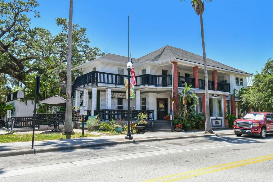 KW Commercial Tampa Properties is proud to exclusively market for sale Harbor Inn on Main, a rare generational asset located in the heart of one of America's most celebrated small towns. With 155 feet of frontage on vibrant Main Street—recently ranked #10 Best Main Street in the U.S. and #5 Best Small Town in the South by USA Today—this mixed-use property offers unmatched charm, versatility, and income potential. Built in 1918 and meticulously maintained, the property features 9,605 SF under roof and 2,599 SF of balcony space. Zoned Main Street Marketplace (MSM), this historic gem supports a wide variety of permitted uses including retail, multi-family, office, hospitality, and entertainment. Currently operating as a top-rated Airbnb Superhost with (8) turnkey apartment units—(6) one-bedrooms and (2) studios—each with full kitchens and baths, this income-generating property is perfect for investors or owner-occupiers. An opportunity also exists to expand with an additional unit or owner/manager’s suite. The ground-floor retail space is elevated above street level and flooded with natural light, offering excellent visibility and a welcoming Main Street presence. Vacant retail square footage equal to 2,983 SF is available for immediate lease or occupancy. Recent capital improvements include a new roof (2020) and new HVAC with ductwork (2023) in the retail space. Additional highlights: 14 private parking spaces, garage/storage space, located in Flood Zone X, just blocks from the iconic Safety Harbor Spa, two majestic “Great Oaks” on site, steps away from the lively Third Friday Street Festival—a monthly downtown celebration of music, art, food, and community. This is more than a property—it’s a piece of Safety Harbor history with modern upside.