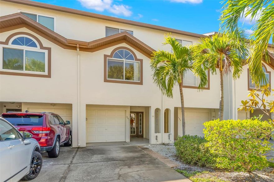 Welcome to coastal living at its finest! This beautifully updated three-bedroom, three-bath townhome is tucked within the desirable Palms of Tierra community, offering resort-style amenities and a prime Tierra Verde location just minutes from award-winning beaches, waterfront dining, and vibrant downtown St. Petersburg. Step inside to an inviting, light-filled living space, an open floor plan, a wood burning fireplace and sliding doors that lead to a covered, private balcony—perfect for enjoying your morning coffee or an evening cocktail. The kitchen offers generous cabinetry, a breakfast bar, and an easy flow ideal for both entertaining and everyday living. Each of the three bedrooms provides comfort and privacy, vaulted ceilings, an en suite bathroom, and double closets with custom built ins. The large primary suite has high ceilings, its own covered balcony, walk-in closet, and en-suite bath with a skylight. The oversized garage offers plenty of storage, room for water toys, and direct access to yet another covered outdoor space perfect for barbecuing. Community amenities include a sparkling heated pool, spa, tennis and pickleball courts, fitness room, and beautifully maintained tropical grounds. Just moments away, you’ll find waterfront dining, boat ramps, marinas, Fort De Soto Park, and miles of scenic trails—an outdoor lover’s dream. Whether you’re seeking a full-time residence or a low-maintenance vacation retreat, this townhome blends comfort, convenience, and that unmistakable Tierra Verde lifestyle. Move-in ready and waiting for you to enjoy!