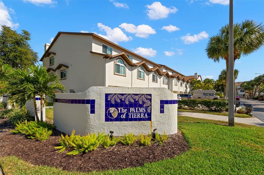 Welcome to coastal living at its finest! This beautifully updated three-bedroom, three-bath townhome is tucked within the desirable Palms of Tierra community, offering resort-style amenities and a prime Tierra Verde location just minutes from award-winning beaches, waterfront dining, and vibrant downtown St. Petersburg. Step inside to an inviting, light-filled living space, an open floor plan, a wood burning fireplace and sliding doors that lead to a covered, private balcony—perfect for enjoying your morning coffee or an evening cocktail. The kitchen offers generous cabinetry, a breakfast bar, and an easy flow ideal for both entertaining and everyday living. Each of the three bedrooms provides comfort and privacy, vaulted ceilings, an en suite bathroom, double closets with custom built ins. The large primary suite has high ceilings, its own covered balcony, walk-in closet, and en-suite bath with a skylight. The oversized garage offers plenty of storage, room for water toys, and direct access to yet another covered outdoor space perfect for barbecuing. Community amenities include a sparkling heated pool, spa, tennis and pickleball courts, fitness room, and beautifully maintained tropical grounds. Just moments away, you’ll find waterfront dining, boat ramps, marinas, Fort De Soto Park, and miles of scenic trails—an outdoor lover’s dream. Whether you’re seeking a full-time residence or a low-maintenance vacation retreat, this townhome blends comfort, convenience, and that unmistakable Tierra Verde lifestyle. Move-in ready and waiting for you to enjoy!
