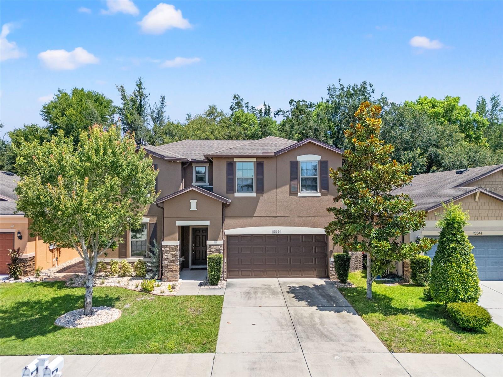 Welcome to 15531 Stone House Drive, in Brooksville Florida, featuring 2,826 sq ft of living space in the highly sought-after community of Trillium! This beautifully maintained 4-bedroom, 2.5-bathroom home is thoughtfully designed to accommodate every stage of life with room to spread out and grow. Step inside and be greeted by wide-plank laminate flooring that flows throughout the entire home—no carpet here! It’s as stylish as it is low-maintenance, offering a modern, cohesive feel in every room.The heart of the home is the spacious kitchen, featuring granite countertops, stainless steel appliances, abundant cabinetry, and a convenient closet pantry for all your storage needs. Whether you're meal prepping or entertaining, this kitchen is ready for it all. The main-level primary suite offers a peaceful retreat with an en-suite bath and generous walk-in closet—tucked away for privacy, yet conveniently located. You'll also find a flexible bonus room on the first floor that’s currently set up as a dedicated home office—perfect for working remotely—but could also serve as a playroom, craft room, hobby space, or reading nook. The options are endless to fit your lifestyle. Upstairs, discover three additional bedrooms and an expansive centralized flex space—ideal for a media room, game room, study zone, or second living area. Whatever your needs, this home adapts beautifully. Outside, enjoy a freshly painted exterior, a fully privacy-fenced backyard, and a covered rear porch that’s perfect for your morning coffee or unwinding after a long day. Located just minutes from Cortez Blvd., and with Publix just around the corner, you’ll have easy access to all your shopping, dining, and entertainment needs. Located just minutes from Cortez Blvd. for all your shopping, dining, and entertainment needs, this home also offers easy access to the Suncoast Parkway and US 41—making travel a breeze. Head south for an easy commute to Tampa or St. Petersburg, or go north for a weekend adventure in Homosassa or Crystal River—the Nature Coast is right at your fingertips! And when you want to stay close to home, enjoy Trillium’s sparkling resort-style community pool—perfect for soaking up the Florida sunshine. This home truly has it all—space, flexibility, modern features, and a location that can’t be beat. Schedule your private tour today and see why this one is a must-see!