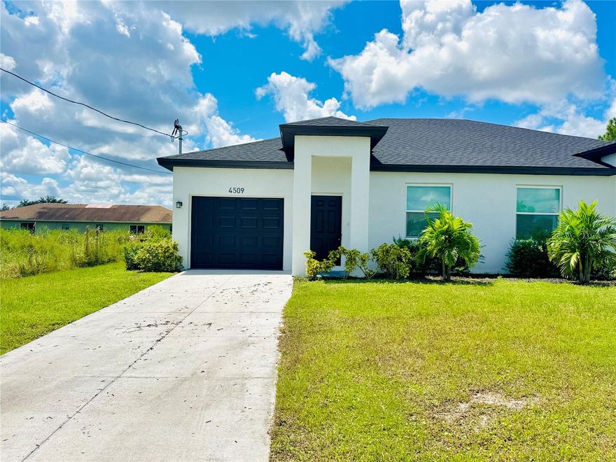 BONUS for tenant! $500 off if tenant signs within the next 7 days. Welcome to this beautiful newer construction home located in the heart of Lehigh Acres. This property offers 3 spacious bedrooms, 2 full bathrooms, and a 1-car garage. The home features a modern open floor plan with plenty of natural light, a stylish kitchen with contemporary finishes, and comfortable living spaces perfect for entertaining or relaxing. Additional highlights include: Move-in ready condition, Convenient single-level layout, Well-sized lanai and backyard for outdoor enjoyment. Great location with easy access to shopping, dining, and main roads. This rental is perfect for those seeking comfort, convenience, and modern living.