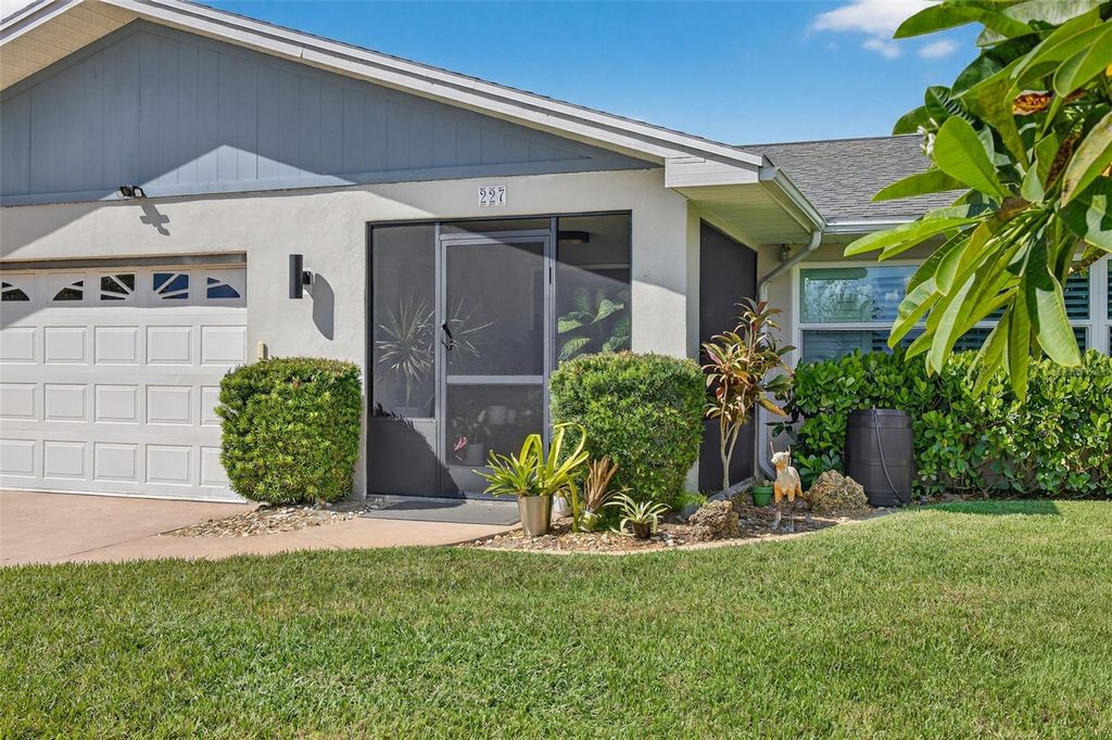 Photo of 227 S Lake Drive, Lehigh Acres, FL 33936 (MLS # TB8434932)