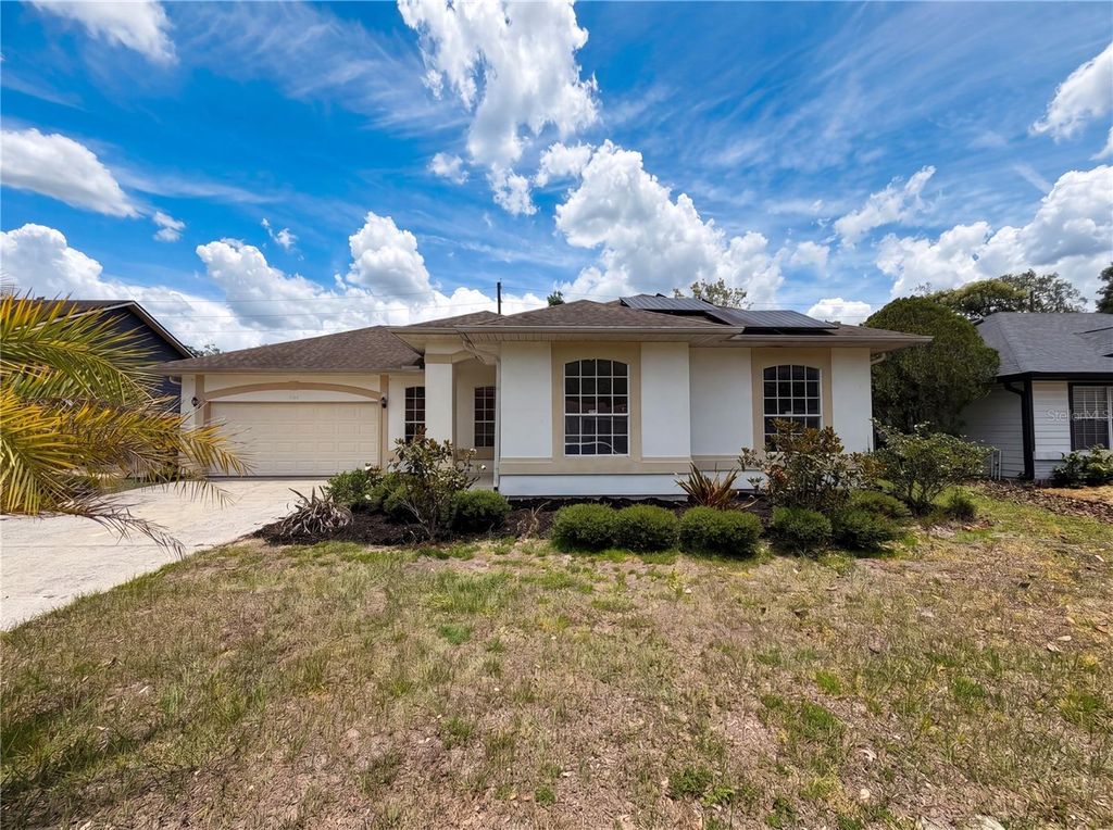 Photo of 5263 Clarion Oaks Drive, Orlando, FL 32808 (MLS # O6410930)