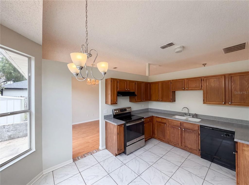 Photo of 5263 Clarion Oaks Drive, Orlando, FL 32808 (MLS # O6410930)