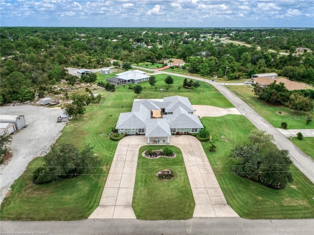 Your Dream Home Awaits! Welcome to this stunning courtyard home. From the moment you step into the beautiful foyer, it is clear that this is not your typical home, but a luxurious residence designed for both comfort and sophistication. Meticulously built and maintained, the home features 5-bedrooms, 3.5-baths and is set on 3+- pristine acres. This meticulous property boasts 3,664 sq. ft. of living space a 4 car attached Garage which combines elegant design with modern conveniences. As you enter, you’re greeted by the incredible Portico which leads you to an inviting floor plan.The thoughtful layout includes a bonus room, office, dining room and court yard all designed for versatile living. The heart of the home is the large chef’s kitchen with stainless-steel appliances, beautiful cabinetry and an incredible pantry with floor-to-ceiling shelving to ensure abundant storage. The Master suite provides ultimate comfort with a luxurious bathroom featuring a claw-foot tub and spa-like upgrades. The over sized laundry room is as functional as it is stylish, Step outside to your private backyard oasis, complete with a new Bull Frog Jacuzzi spa, large covered back porch and fenced back yard make this space perfect for entertaining or quiet evenings under the stars. The home is equipped with modern upgrades, including: Generac whole-home generator, New roof in 2022 and a Brand-New EVERSAFE 30 x 50 Metal Building (being built this week) w/ 150-AMP hookup, lawn irrigation systems and SO MUCH MORE! Don’t miss out—schedule your private showing today!