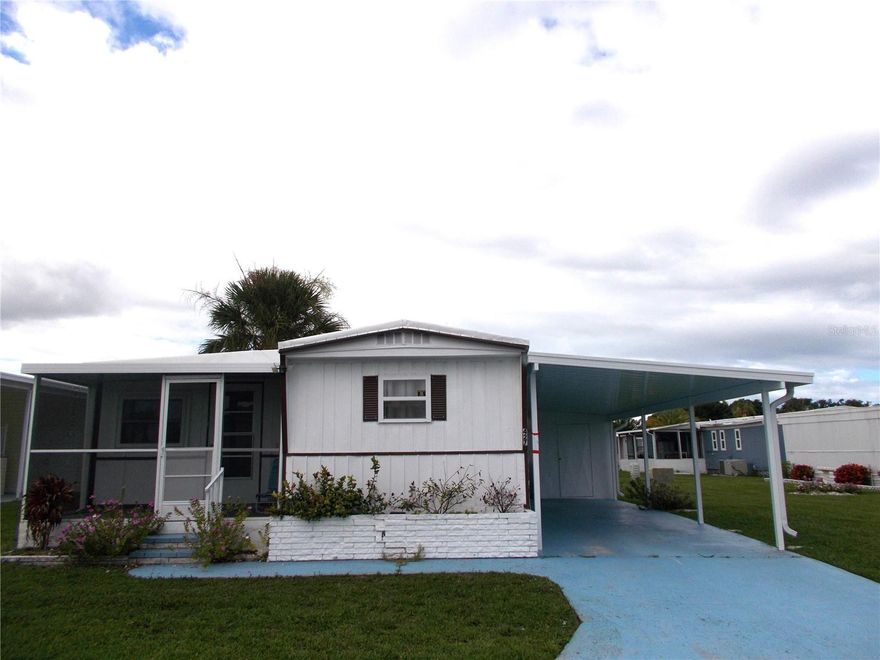 HUGE PRICE REDUCTION AND MOTIVATED SELLER!!!  Why spend another winter in the cold??  This 2 bedroom, 2 bath mobile is waiting to envelop you in the Florida sunshine!  This mobile offers a true split bedroom plan with a large kitchen and a newly renovated living room.  Lots of new here:  roof (2023), some windows, electrical panel (2022), front lanai, carport (2024), washer, dryer & refrigerator.  Sandalwood Park is pet friendly (size, breed & # restrictions) and has a back gate entrance/exit for use by residents which allows for easy access to grocery stores, medical facilities and more.  Low quarterly fees and tons of activities are found here, including the heated pool, shuffleboard courts, card nights, trivia night, bingo, seasonal concerts, potluck dinners and so much more!  There's a reason why Sandalwood Park is so sought after.  Come take a look at this great home today and join the fabulous lifestyle found here in Sandalwood Park!
