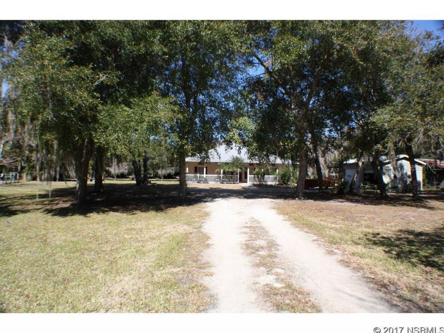RARE FIND SO CLOSE TO THE INTRACOASTAL WATERWAY! QUIET COUNTRY SETTING OF 1.3+/- ACRES STEPS FROM THE RIVER. OVER SIZED END TO END FRONT PORCH IS A GREAT PLACE TO ENJOY THE COASTAL BREEZE. THE COOK WILL LOVE THE LARGE KITCHEN AND THE OPEN FLOOR PLAN IS GREAT FOR ENTERTAINING. THE HOME ALSO OFFERS SPLIT BEDROOMS, VOLUME CEILINGS, INDOOR LAUNDRY, MASTER BATH HAS HIS AND HERS CLOSETS, DOUBLE VANITIES, SEPARATE TUB AND SHOWER. SPRAWLING PROPERTY IS CLEARED, FENCED AND ROOM FOR EVERYTHING WITH DETACHED 2 CAR GARAGE AND SWIMMING POOL WITH OVER SIZED DECK INSIDE SCREENED ENCLOSURE, HORSES OK. LOW MAINTENANCE CONCRETE BLOCK HOME WITH METAL ROOF. CLOSE TO RIVER ACCESS FOR THE BEST RED FISHING IN THE WORLD, RIVERBREEZE PARK AND BOAT RAMPS, SCHOOLS, DINING, AND SHORT DRIVE TO BEACH. USDA ELIGIBLE.