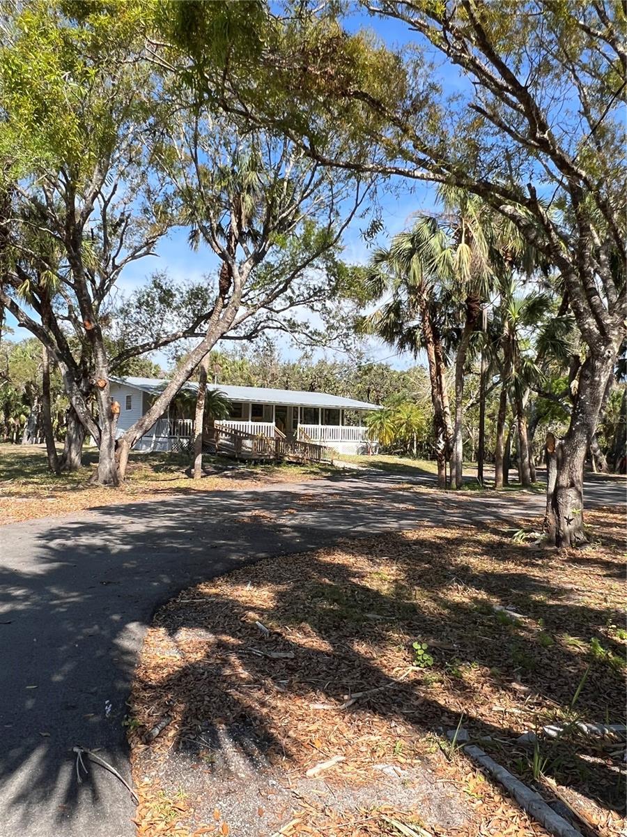 Discover the perfect blend of privacy and comfort in this secluded 2-bedroom, 2-bath single-family home located at 50 Palm Dr, Venice, FL. This unfurnished home offers spacious living with both a front and back open porch, perfect for relaxing and enjoying the serene surroundings. The large screened lanai is an extension of the Living Space and is ideal for outdoor entertaining while offering beautiful views of the river and lush wooded landscape.
Inside you will find a renovated interior with Ceramic Tile Floors, Newer Appliances, Stone Counters and a Large Breakfast Bar as well as convenient Laundry room equipped with a washer and dryer for added convenience. Enjoy the tranquility and natural beauty of this home, making it a peaceful retreat. Water, Septic & Electric & Lawn Mowing are included in the Monthly Rent. HS Internet Connection Available.
Neighborhood offers a community Kayak/Canoe/Small Boat Ramp to the Myakka River just a short walk/drive up Palm Drive
Contact us today to schedule a viewing!