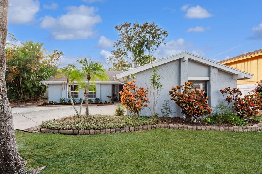 Discover your perfect sanctuary in this exceptional 3-bedroom, 2-bathroom home nestled in the charming Lake St George community of Palm Harbor. This meticulously maintained residence welcomes you with an inviting foyer that sets the tone for the thoughtfully designed floor plan ahead.

The home showcases both formal living and dining rooms for elegant entertaining, while the spacious family room provides the perfect spot for daily relaxation. The well-appointed kitchen features beautiful wood cabinets and flows seamlessly into the living spaces, creating an ideal environment for both quiet family dinners and lively gatherings.

Step outside to your private oasis featuring a generous 75x175 foot lot with a huge, fully-fenced backyard enclosed by attractive white vinyl fencing. The outdoor entertainment possibilities are endless with a wood deck complete with outdoor grill, plus an additional rear patio for those who truly appreciate alfresco living.

Recent updates ensure worry-free homeownership, including new windows installed in 2018, a heating and cooling system from 2019, and a  roof from 2015. These thoughtful improvements mean you can focus on making memories rather than maintenance lists.

Lake St George community amenities enhance your lifestyle with a refreshing community pool, tennis courts, playground, and park, all accessible for a modest semi-annual fee of just $213. The location strikes the perfect balance, offering peaceful residential living while remaining conveniently close to shopping destinations, pristine beaches, and the airport for easy travel access.  Do not miss viewing this beautiful home!