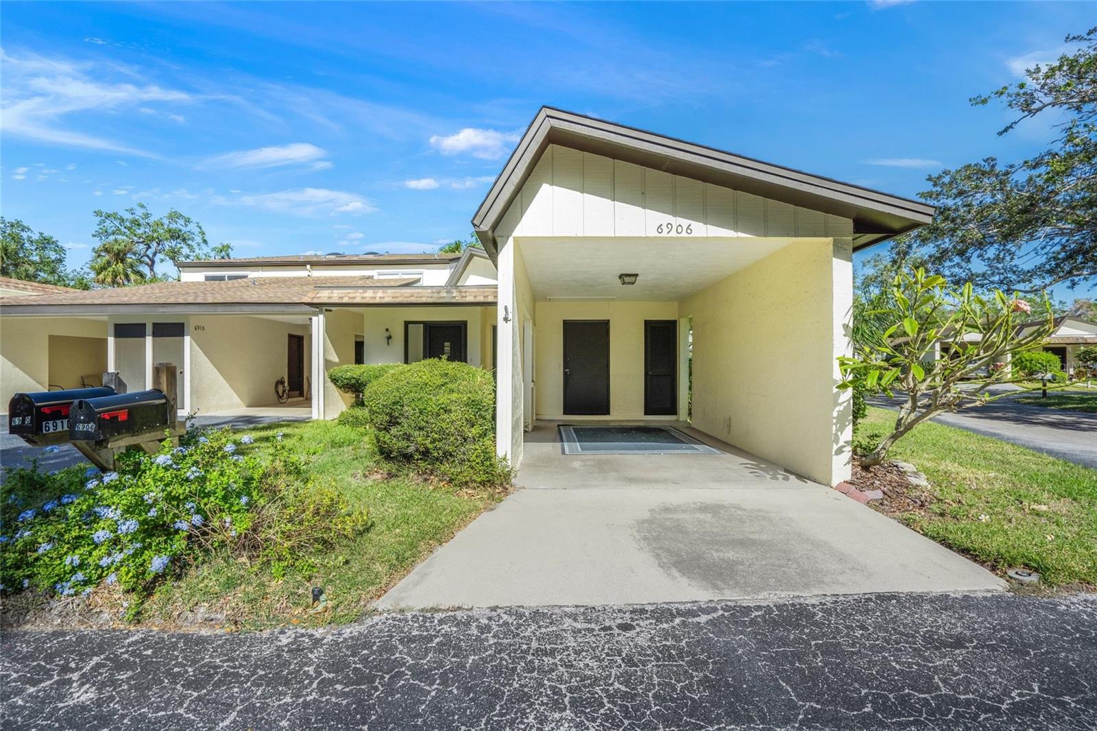 Discover the charm of Old Florida living at 6906 Woodwind Dr, a bright and airy 2-bedroom, 2-bathroom villa in the peaceful Woodside Village East. This well-maintained home features soaring ceilings and abundant natural light that create an inviting atmosphere throughout. Freshly painted and newly carpeted, it’s move-in ready and waiting for your personal touch. The thoughtfully designed floor plan includes a spacious living area, an enclosed patio perfect for enjoying serene mornings or evening breezes, and a master bedroom with sliding glass doors that open to a private fenced lanai—ideal for gardening or enjoying fresh air in complete tranquility. The home also features the convenience of an in-unit washer and dryer, and a covered carport with an additional storage closet, perfect for beach gear or seasonal items. Located just 3.5 miles from Siesta Key Beach and moments from Gulf Gate Village's vibrant restaurants and shops, this home offers the best of Sarasota’s lifestyle. The community amenities include a sparkling pool, tennis/pickleball courts, and beautifully shaded walking paths, providing endless opportunities for relaxation and recreation. Whether you're seeking a full-time residence, a seasonal retreat, or a smart investment opportunity in one of Sarasota’s most desirable areas, this villa delivers exceptional value. Schedule your private showing today and imagine the possibilities!