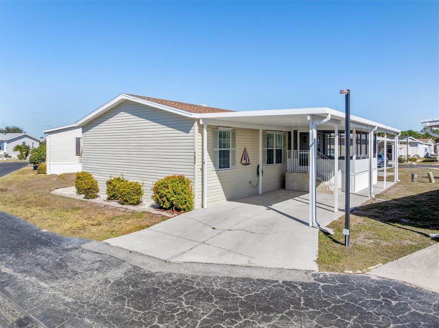 This beautifully maintained 2006 3-bedroom, 2-bath, 1 car carport double wide manufactured home is located in the highly desirable 55+ co-op community of Port Charlotte Village. Best of all, it is not in a flood zone and offers a low HOA fee that covers everything except your electric bill. From the moment you arrive, you’ll love the inviting screened front porch, the perfect place to relax and enjoy your morning coffee. Inside, this immaculate home welcomes you with a spacious, open floor plan and a roof replaced in 2023, giving you added peace of mind. The very large living room is ideal for entertaining, complete with cathedral ceilings and a ceiling fan that enhance the bright and airy feel. The kitchen is both stylish and functional, featuring a glass top stove, dishwasher, and 36-inch cabinets with elegant crown molding. Wood vinyl flooring flows throughout the main living areas, adding warmth and easy maintenance. The large master bedroom offers plenty of space and includes a private ensuite bathroom with a Roman shower, glass doors, and tile flooring. Two additional guest bedrooms provide built-in closets and ceiling fans for comfort and storage. The guest bathroom features a convenient tub and shower combination. A dedicated laundry room with washer and dryer included makes daily chores simple. Step outside to enjoy the covered carport and screened-in lanai. Living in Port Charlotte Village means access to an active and welcoming community packed with amenities. Residents enjoy a heated pool, shuffleboard and Bocce Ball courts, horseshoe pits, a dog park, garden area, and greenhouse. There is even a scenic lake for fishing, canoeing, or kayaking. The clubhouse offers a library, billiard room, card room, and lounge, creating endless opportunities for recreation and connection. With a low HOA fee of just $320 per month, your dues include cable TV, internet, trash, water, sewer, exterior maintenance, and full access to recreational facilities. This prime location is near medical facilities, golf courses, restaurants, and shopping, with easy access to I-75, US 41, and Punta Gorda Airport. Schedule your showing today and discover the comfort, convenience, and vibrant lifestyle waiting for you in this exceptional Port Charlotte home.